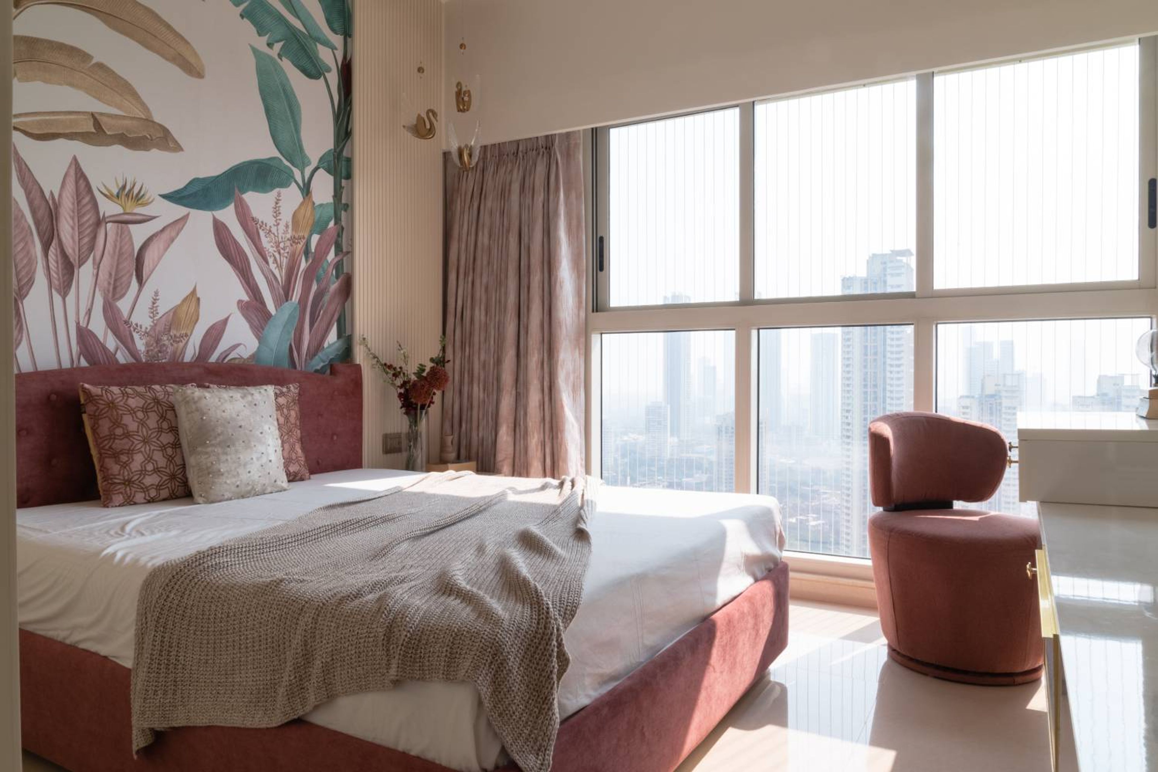 Bedroom Design with Botanical Wall Mural, Tufted Pink Headboard, and Textured Accent Paneling