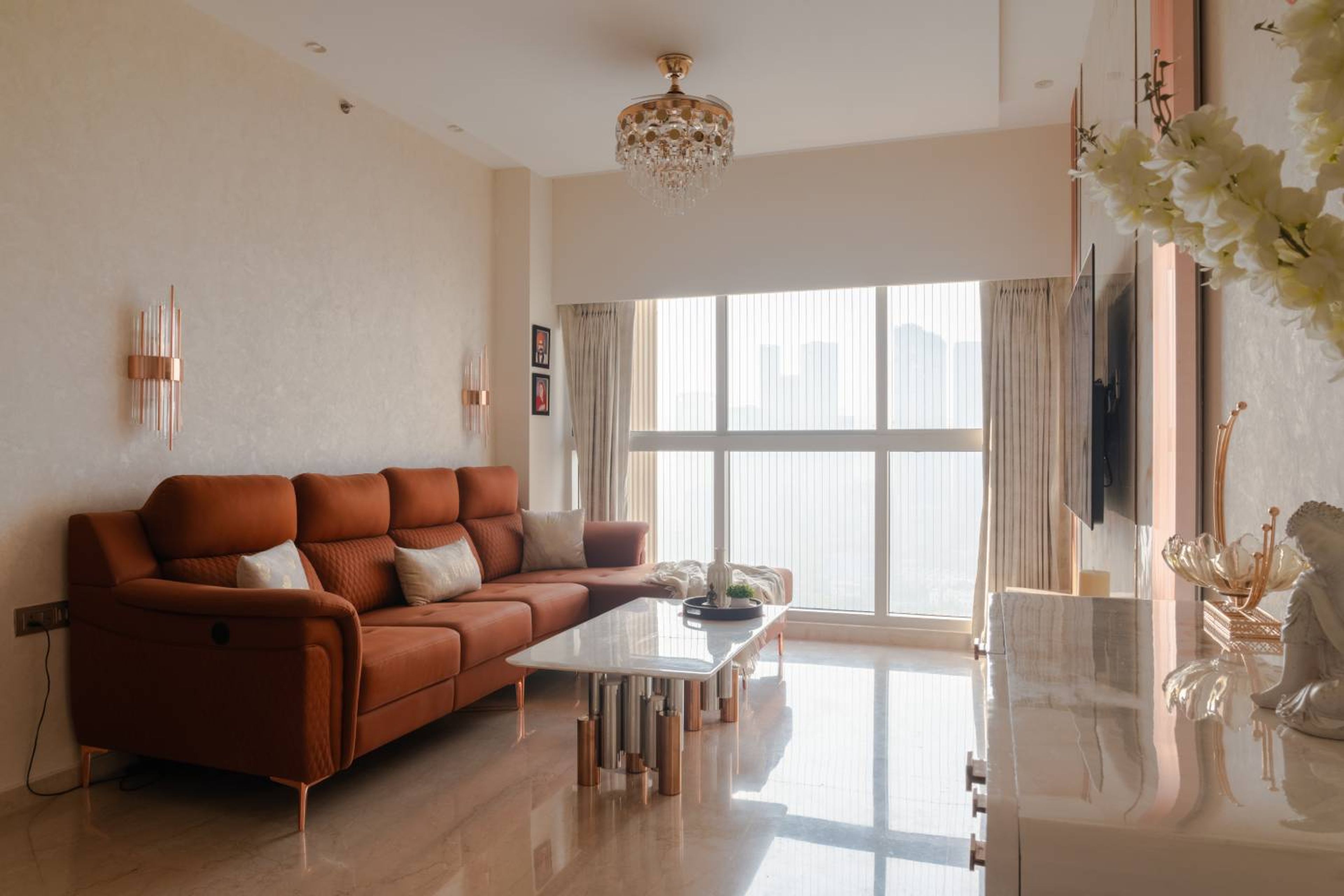 Living Room Design with Rust Orange L-Shaped Sofa and Textured White Wall