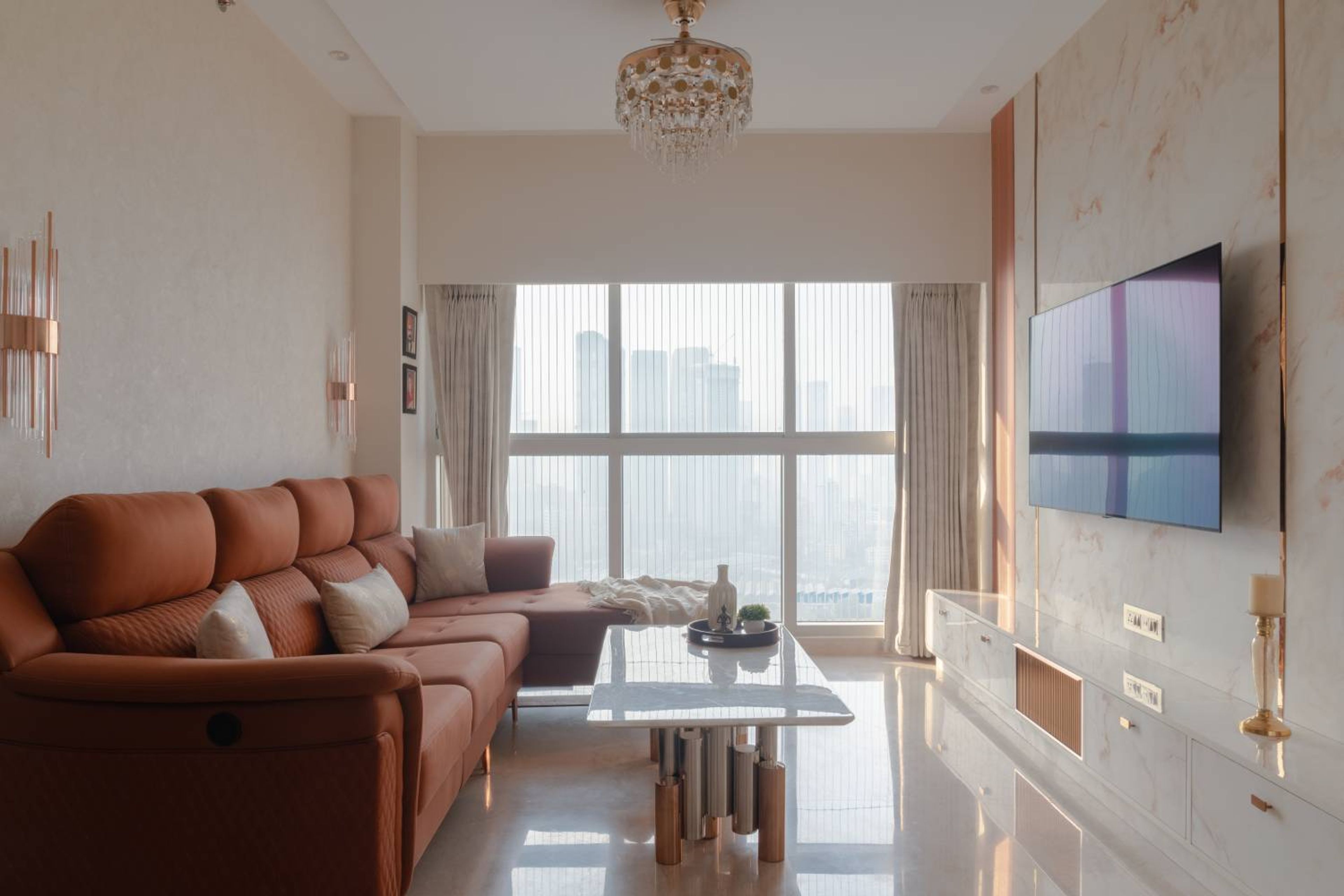 Living Room Design with Rust Orange L-Shaped Sofa and TV Unit