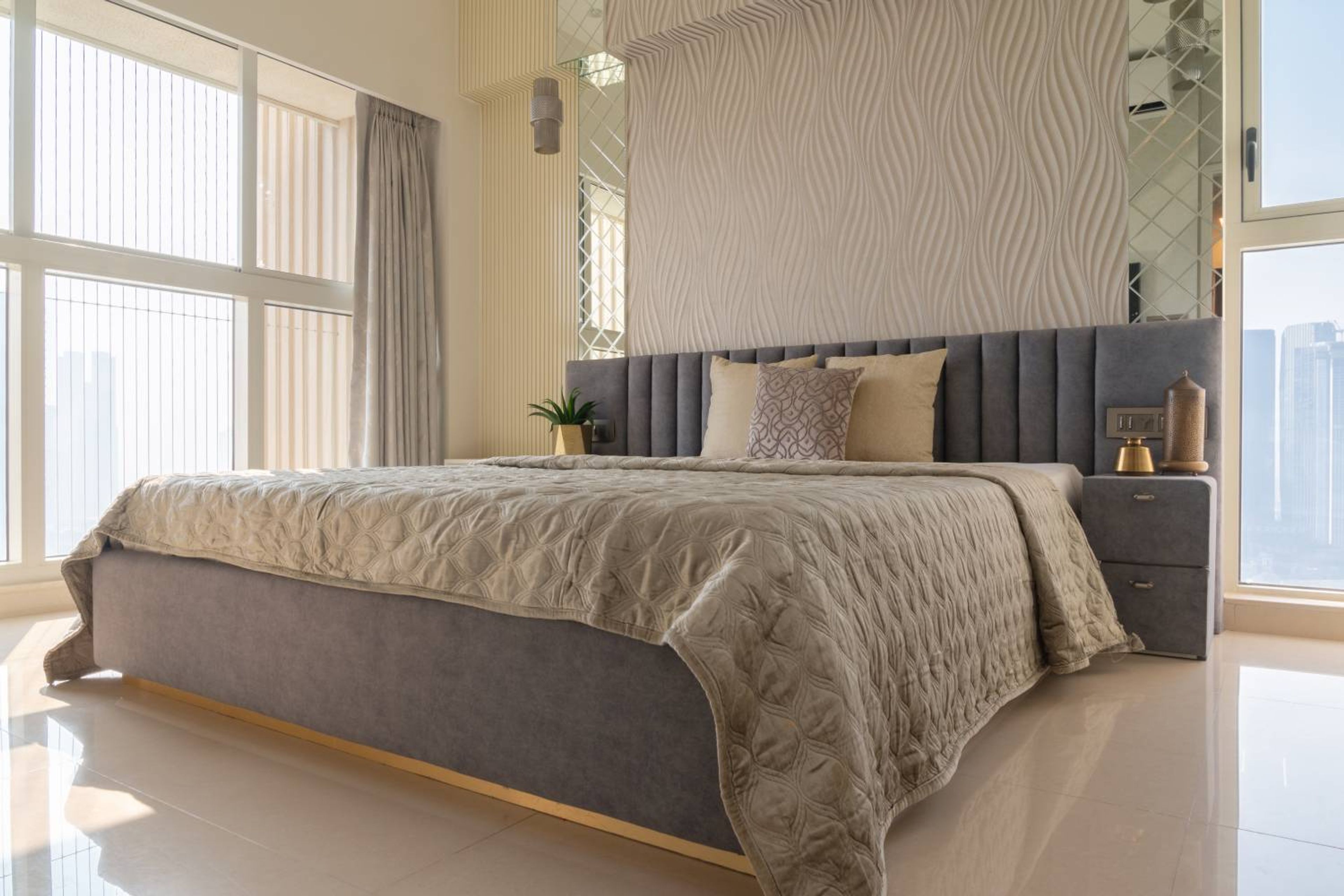 Bedroom Design with Tufted Grey Headboard Bed and Textured Grey Wall