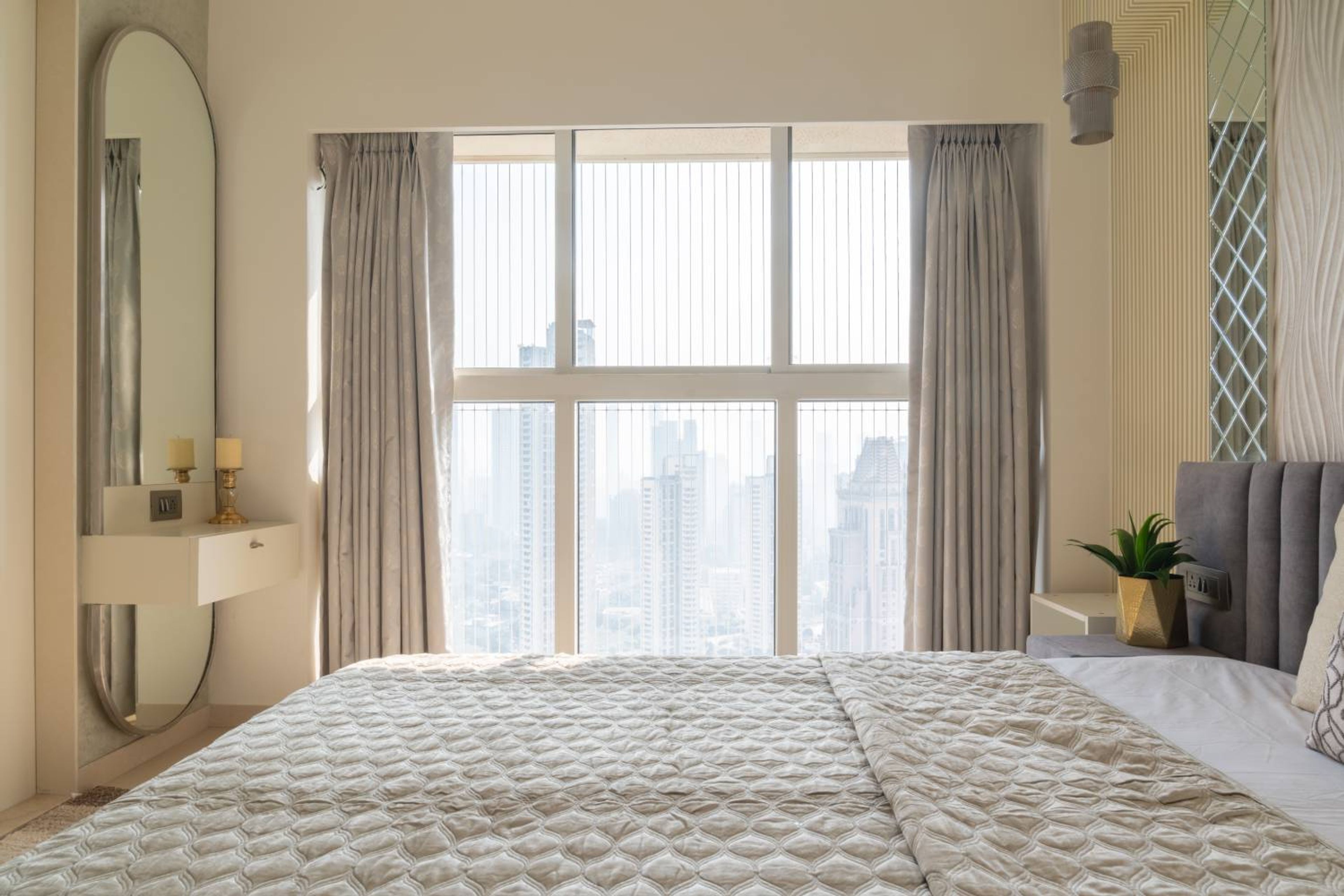 Bedroom Design with Wall Mounted Oval Mirror with Drawer