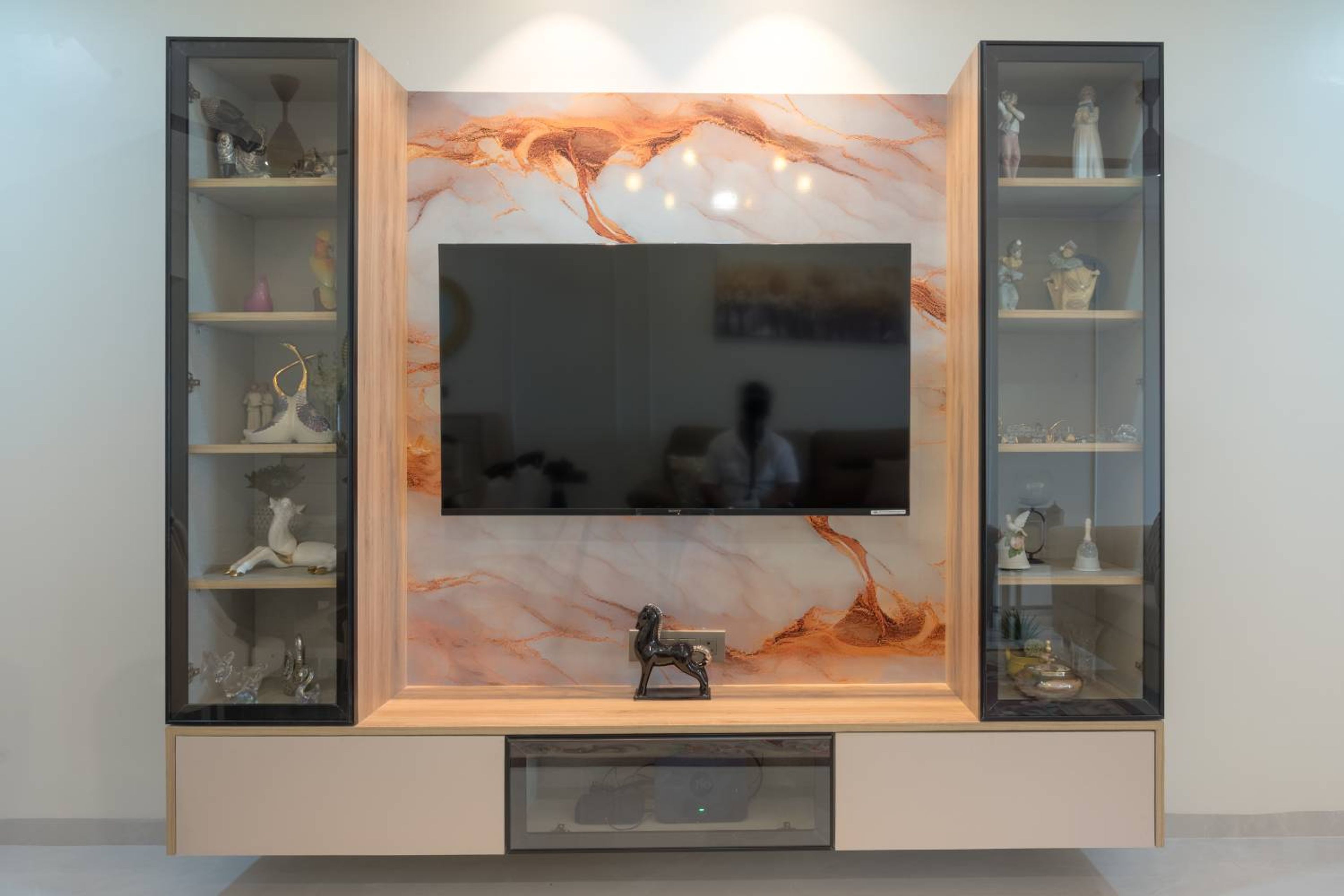 TV Unit Design with Marble Patterned Backsplash and Wall Mounted Units