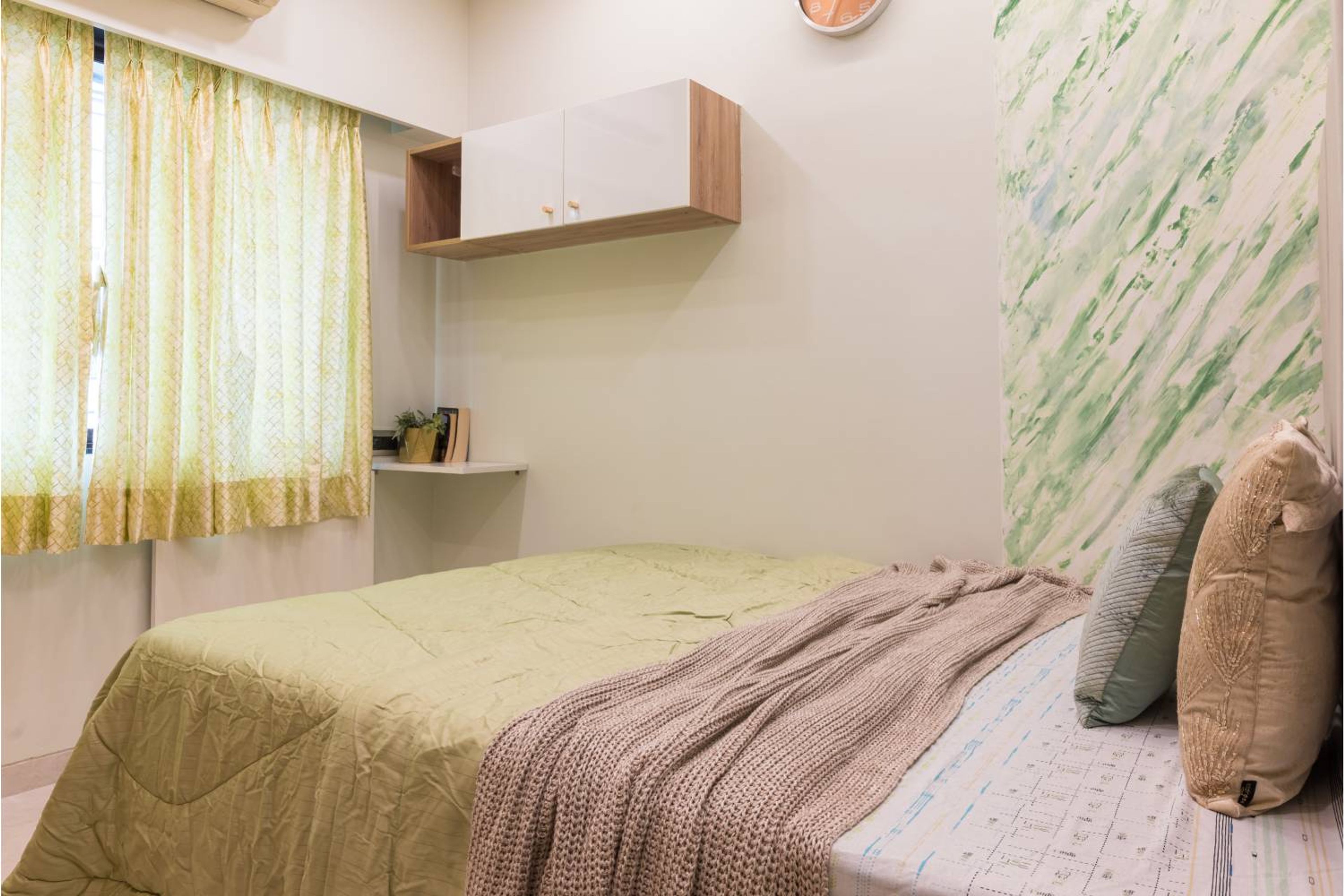 Guest Bedroom Design with Marble Accent Wallpaper and Queen Bed