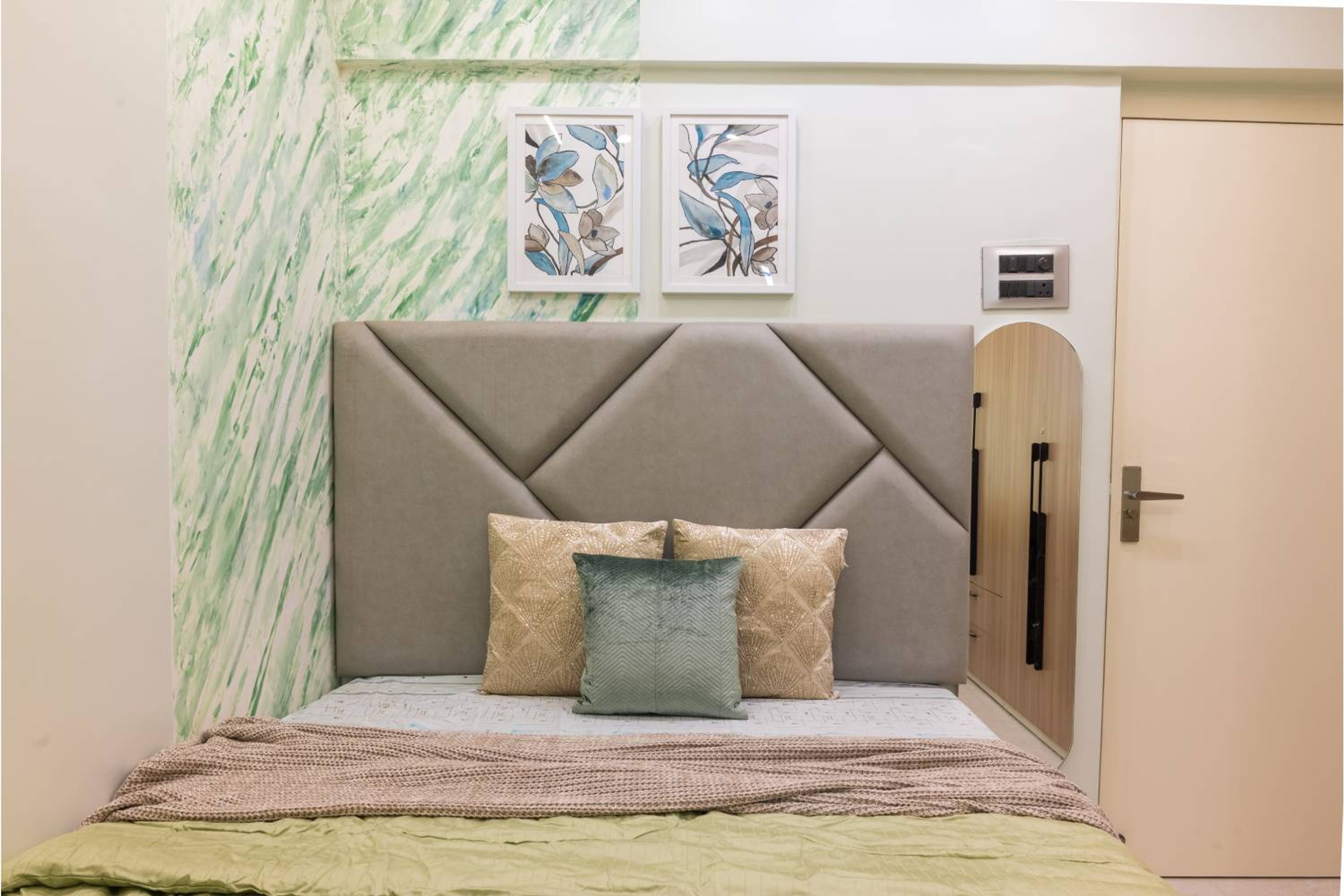 Contemporary Guest Bedroom Design with Marble Accent Wallpaper and Queen Bed