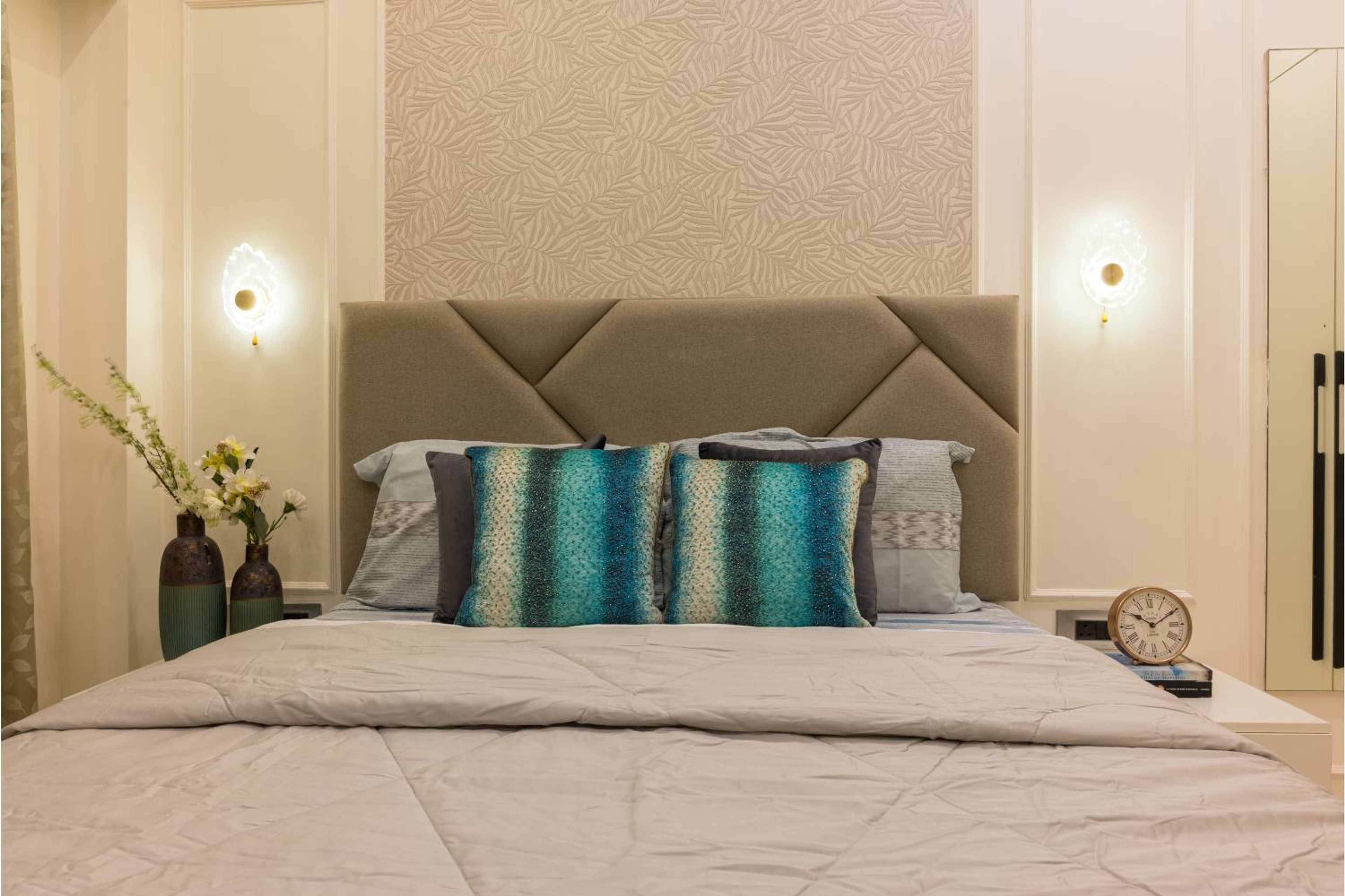 Master Bedroom Design with Padded Headboard and Beige Patterned Wall with Trims