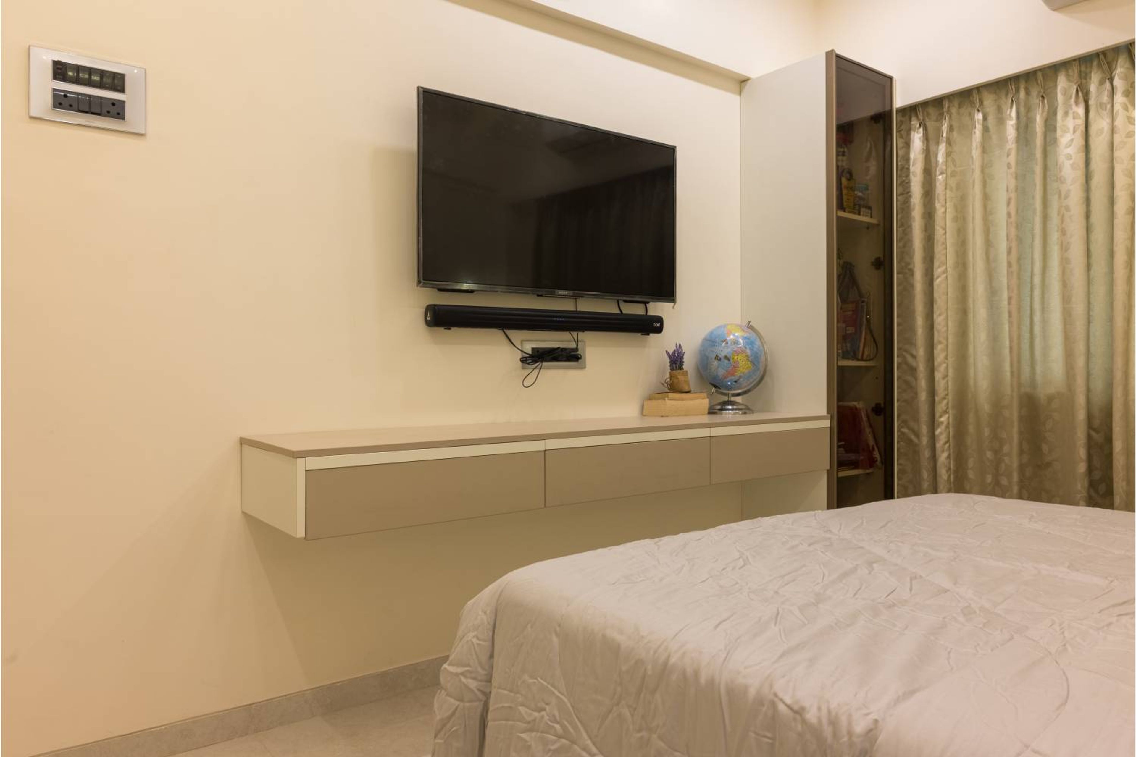 Minimal White and Beige Bedroom TV Unit Design With Floating Drawers and Glass Cabinet