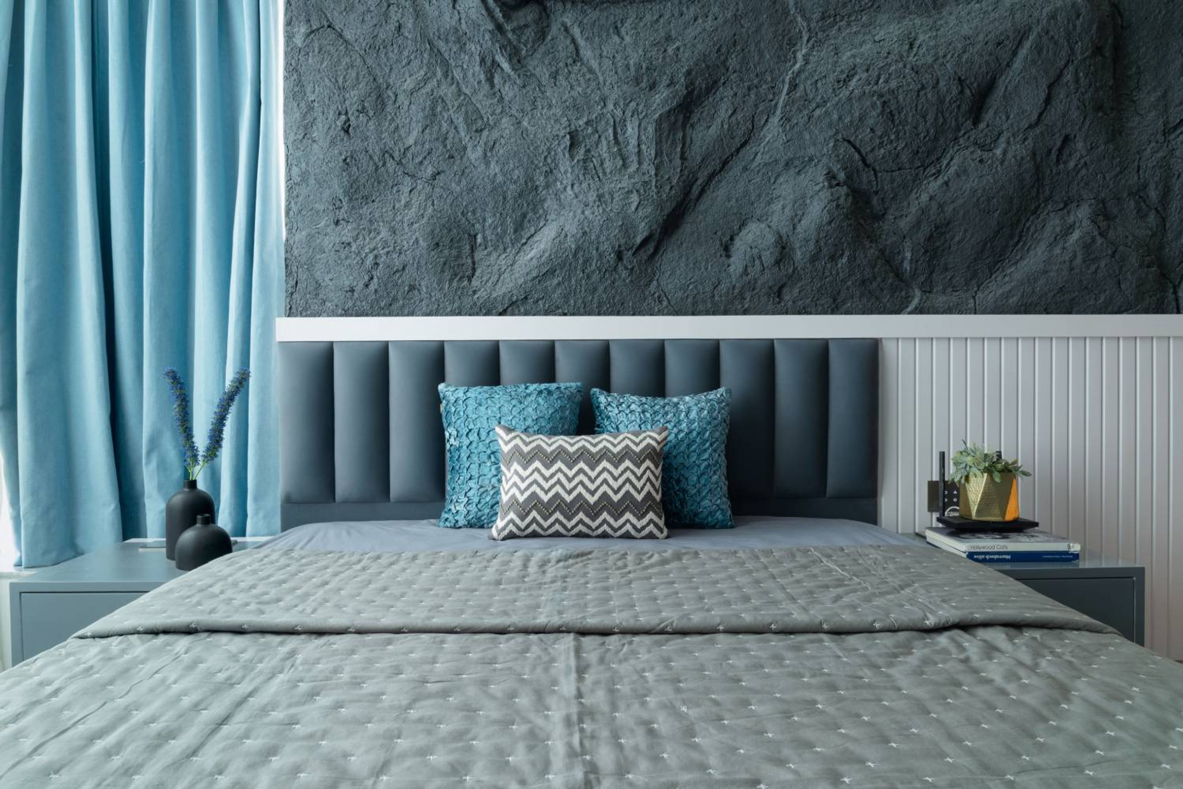 Bedroom design with grey rock textured wall
