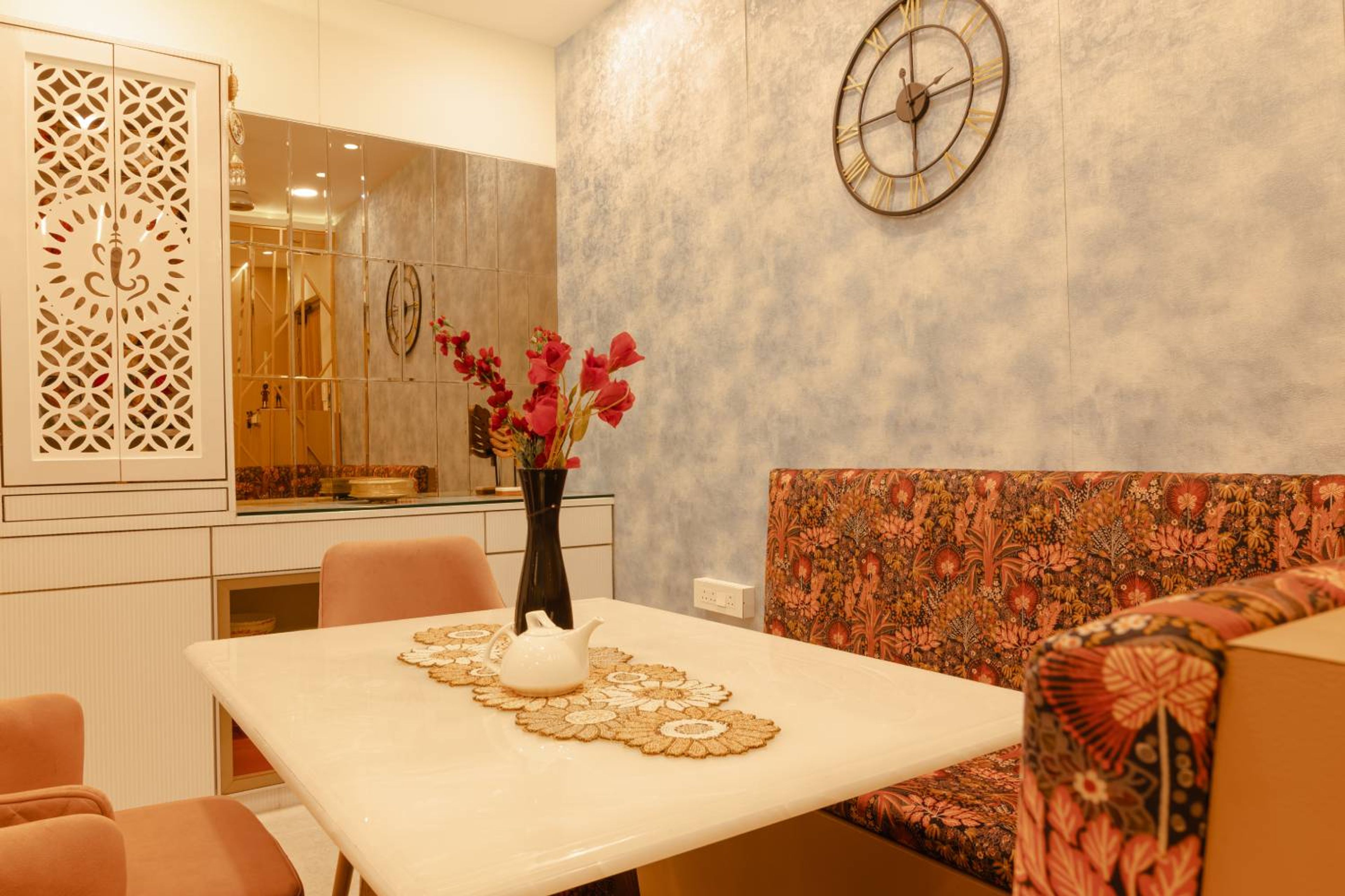 Orange dining room design with white marble top table