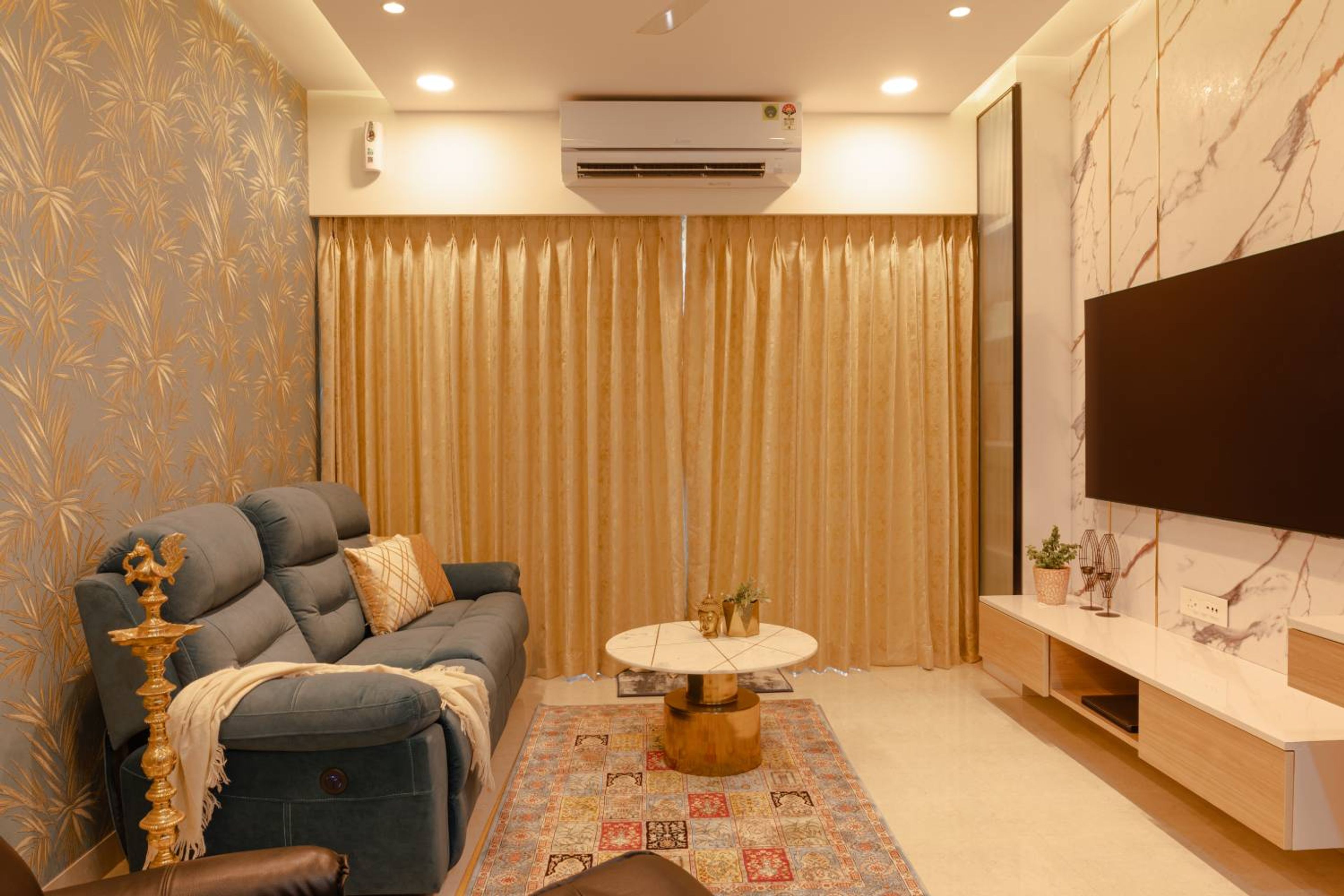 Living room design with grey sofa and TV unit