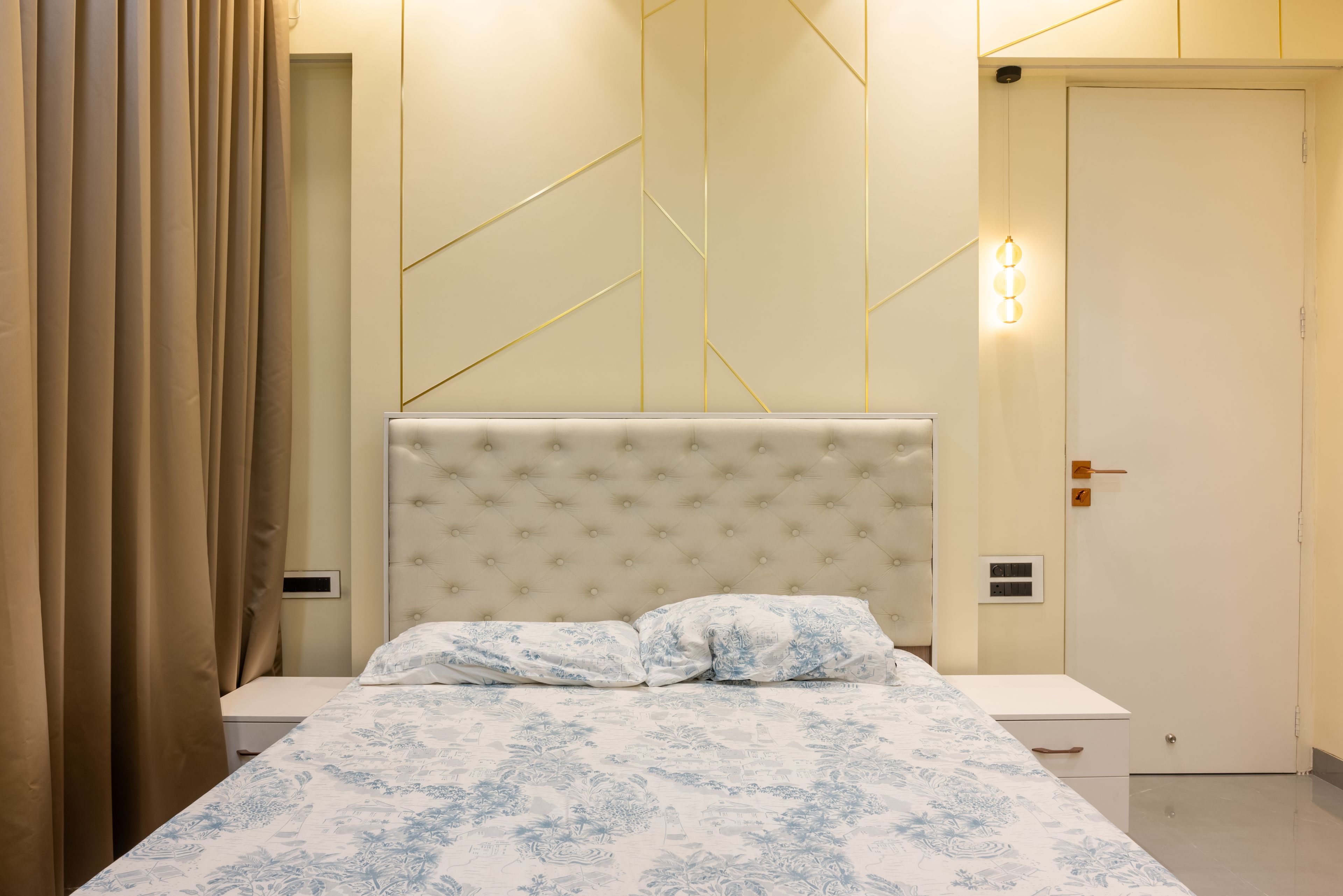 Modern Guest Bedroom Design with Queen Size Bed and Golden Trim