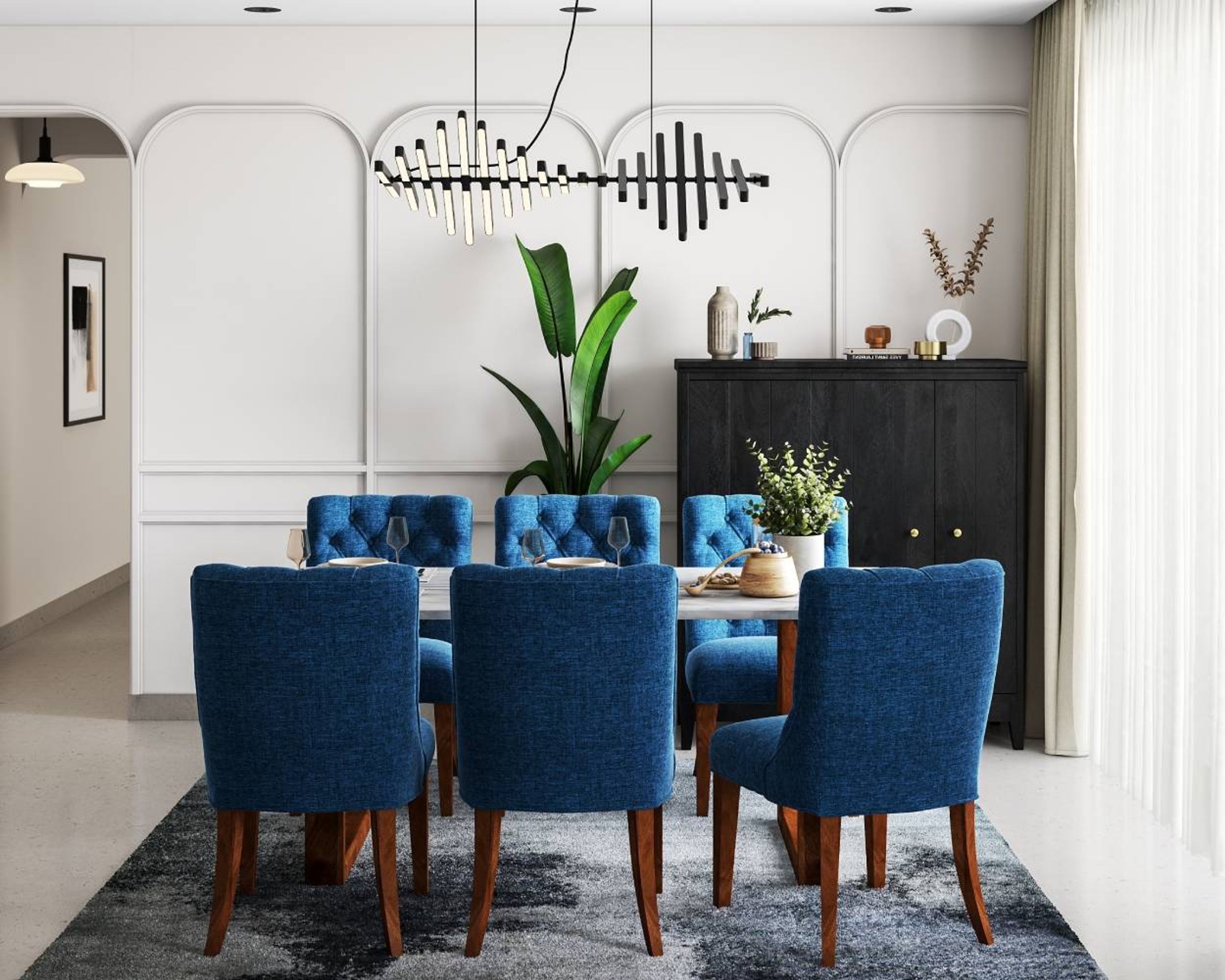 Dining Room Design with 6-Seater Marble Table Top, Blue Upholstered Chairs, Chandelier and White Panelled Walls