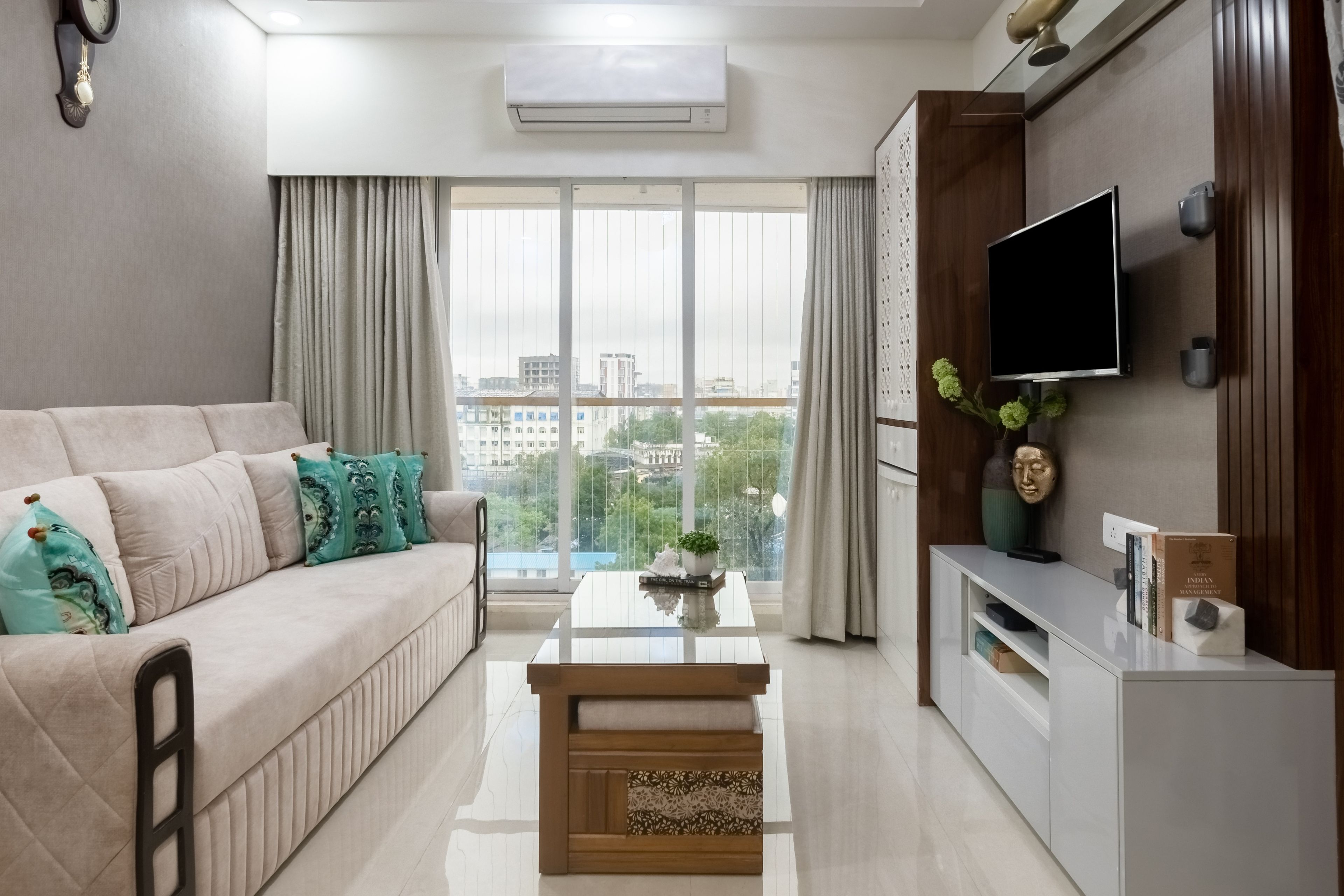 Living Room Design with 3-Seater Light Beige Sofa, White High-Gloss Laminate TV Unit, Grey Textured Wall and Wooden Central Table