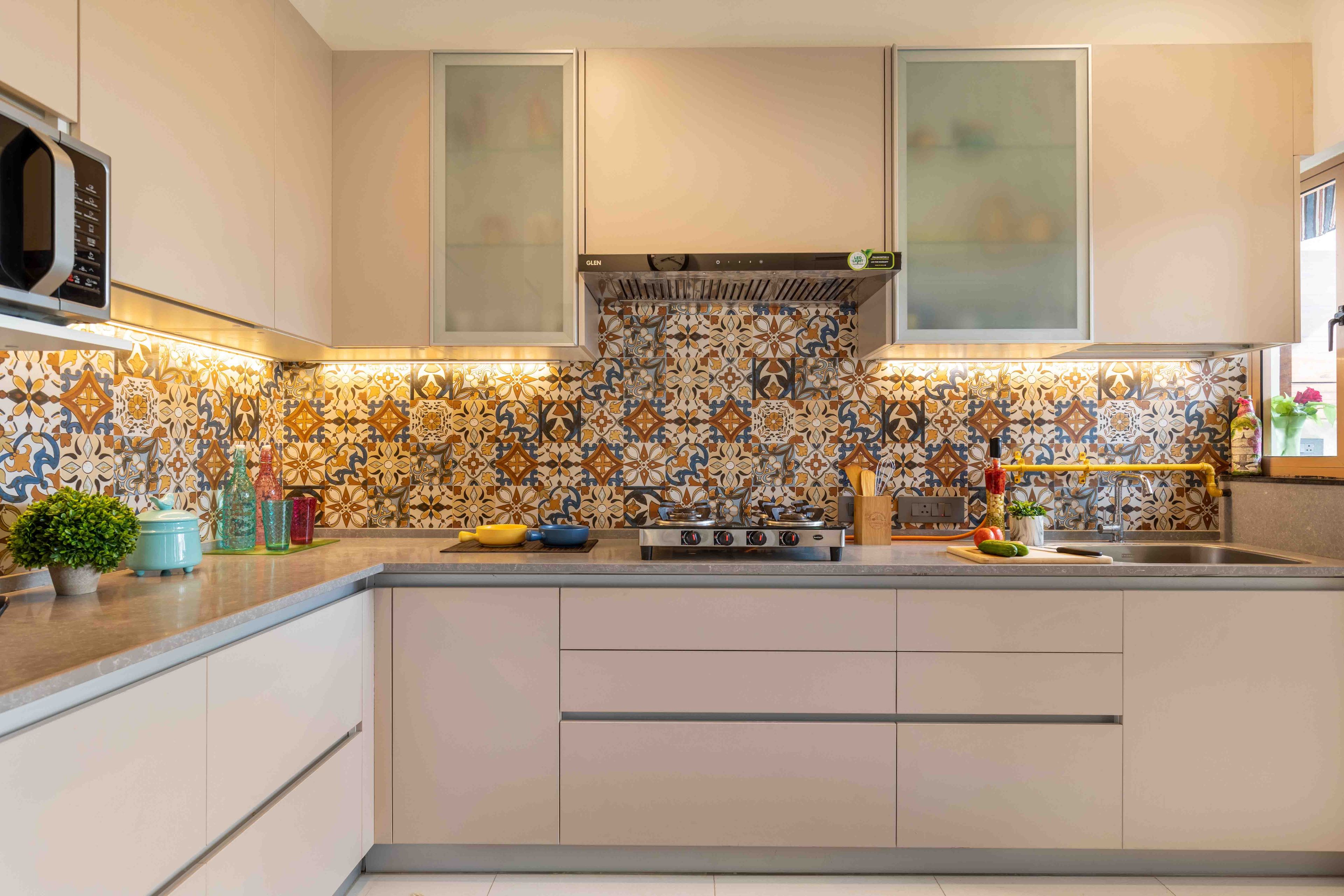 L-Shaped Modular Kitchen Design with Light Peach Wall Cabinets, Drawers and Moroccan Tiles