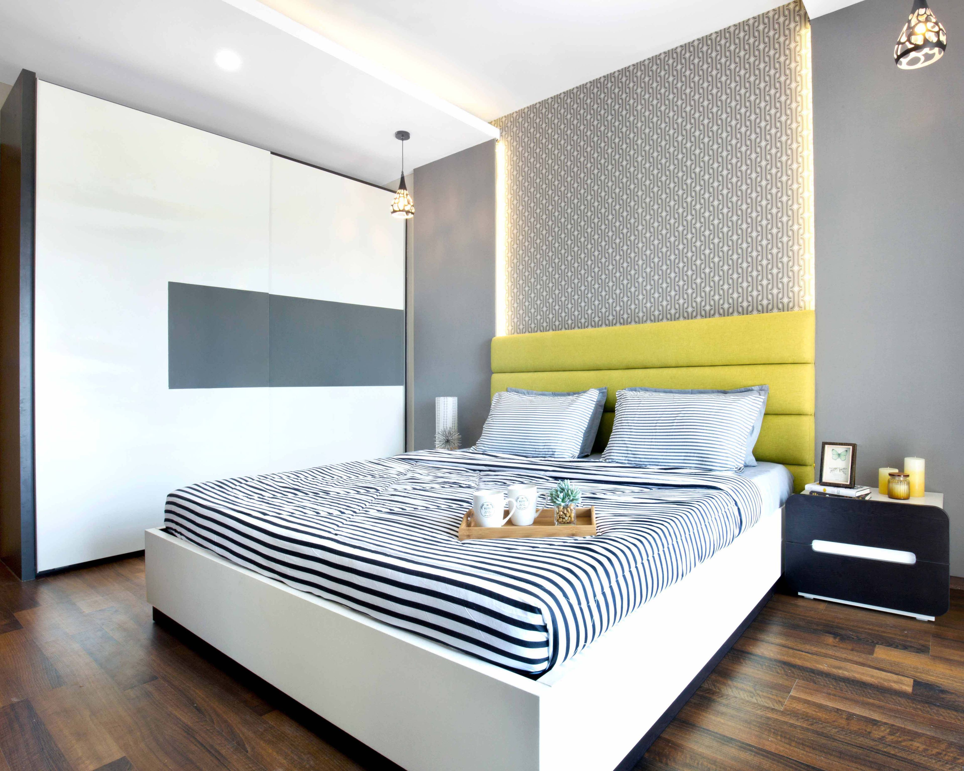 Guest Bedroom Design with 2-Door Sliding Wardrobe, Grey Patterned Wall with Cove Light, and Yellow Cushioned Headboard Bed