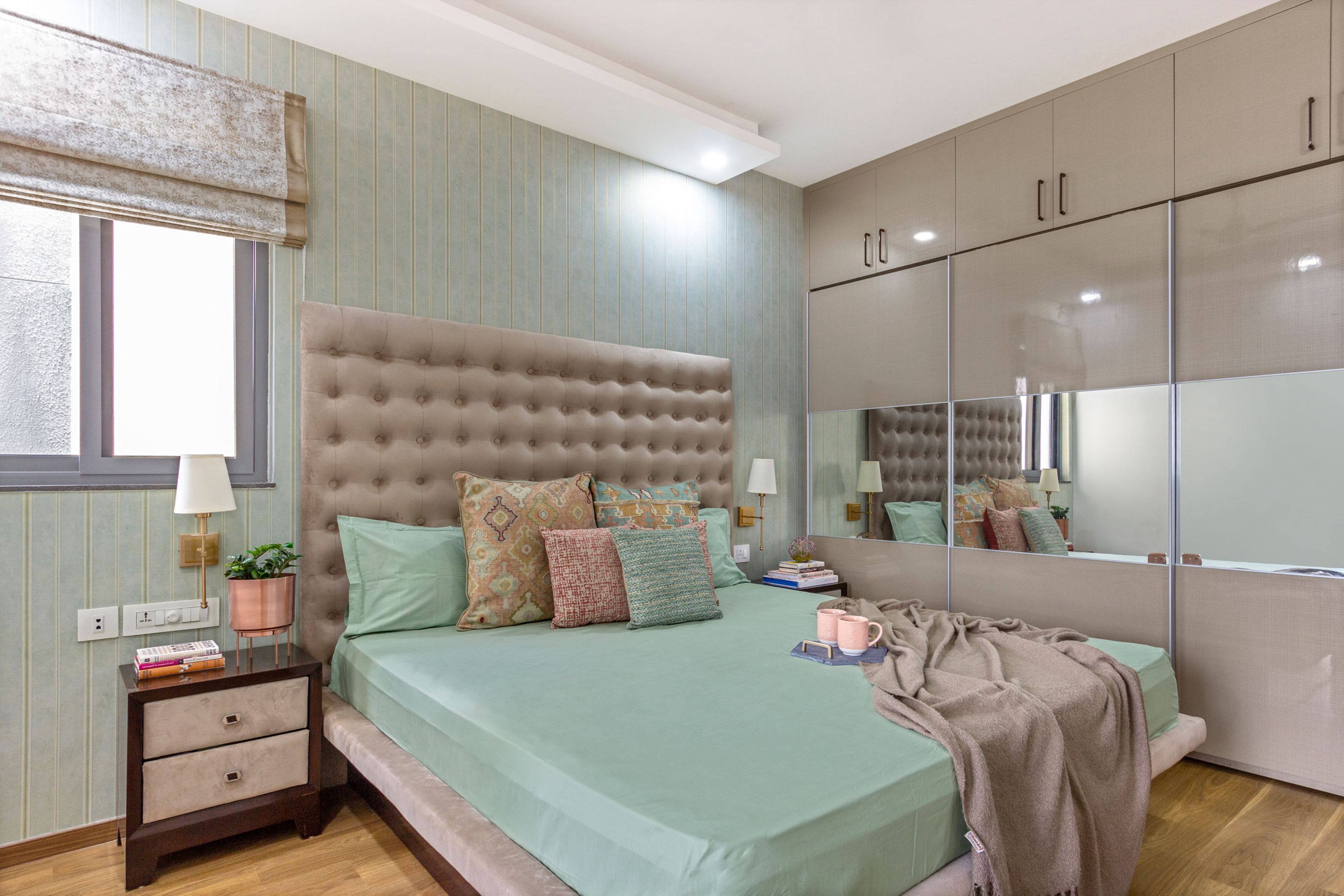 Master Bedroom Design with 3-Door Sliding Wardrobe with Integrated Mirror and Blue Wallpaper