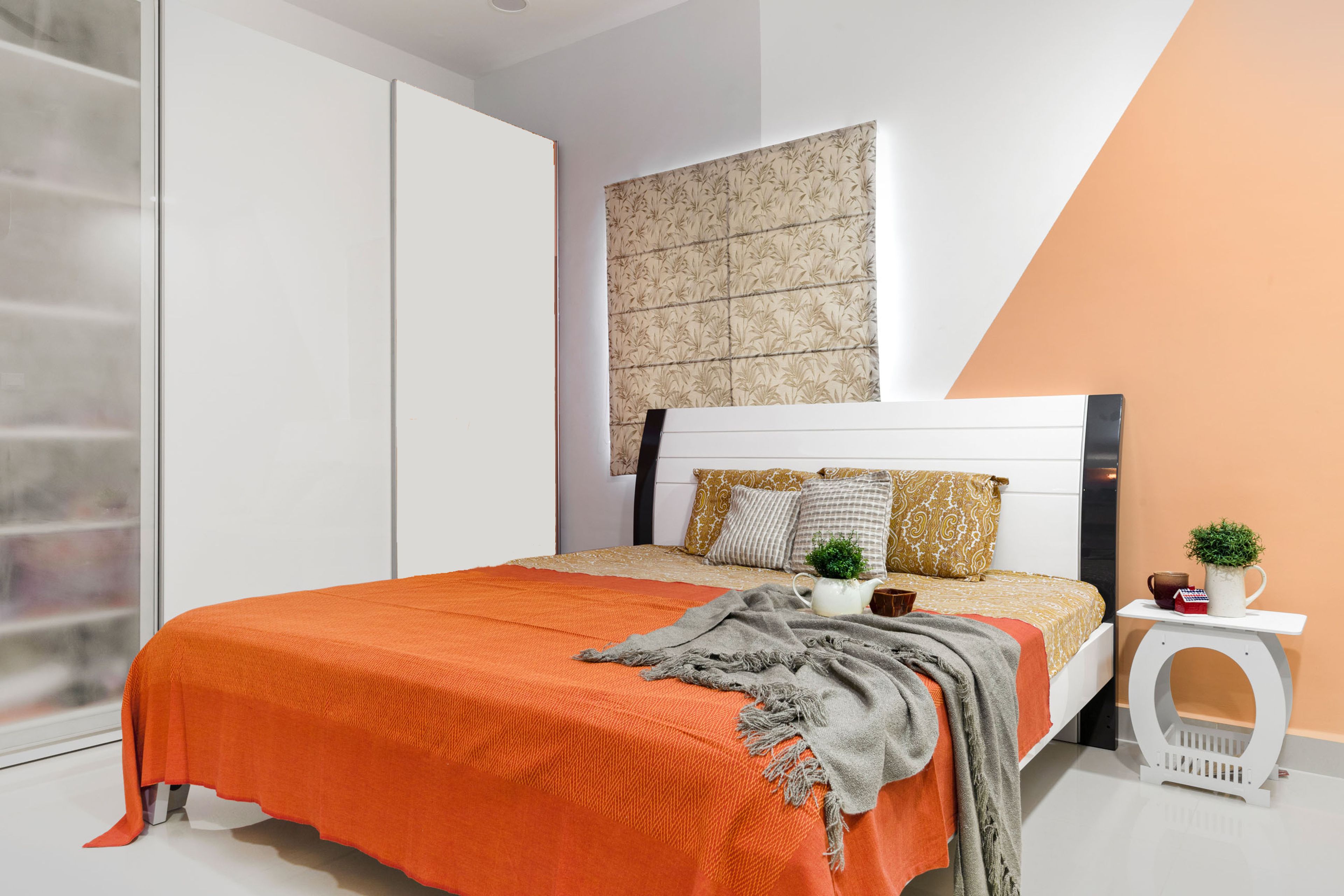Guest Bedroom Design with White and Orange Wall and White 2-Door Sliding Wardrobe