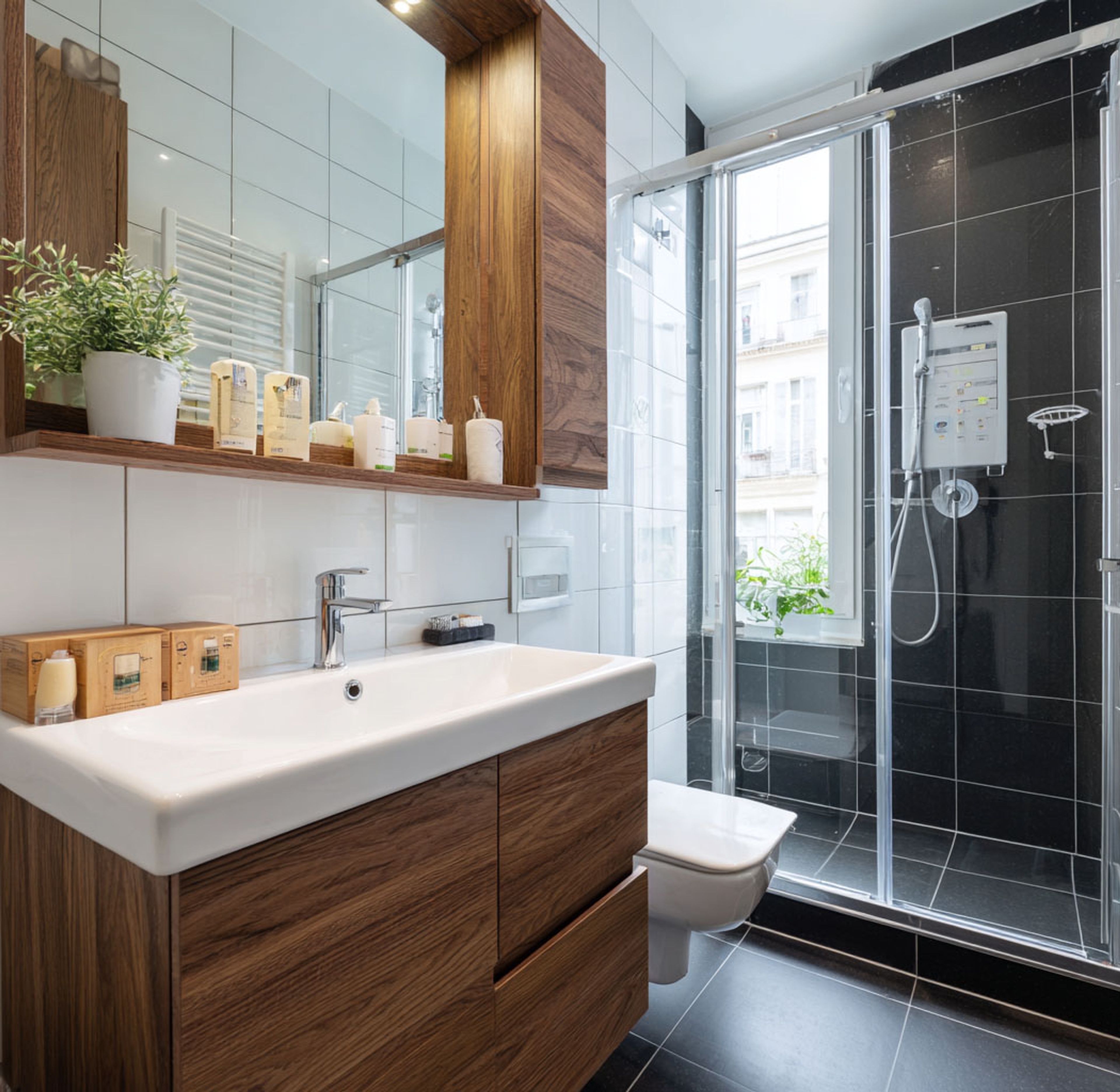Modern Bathroom Design with Black Flooring and Freestanding Tub
