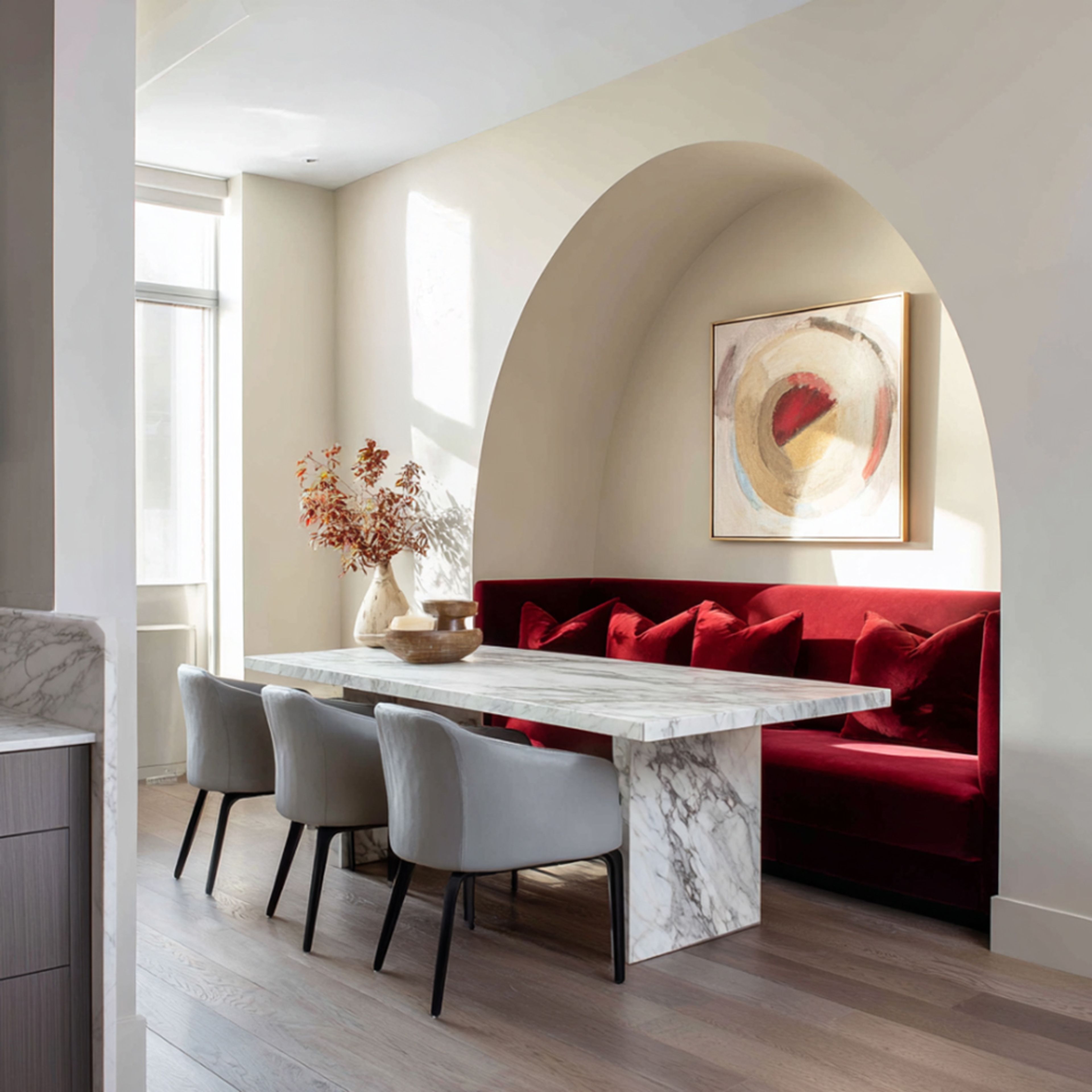 Dining Room Design With Marble Table and Red Velvet Seating
