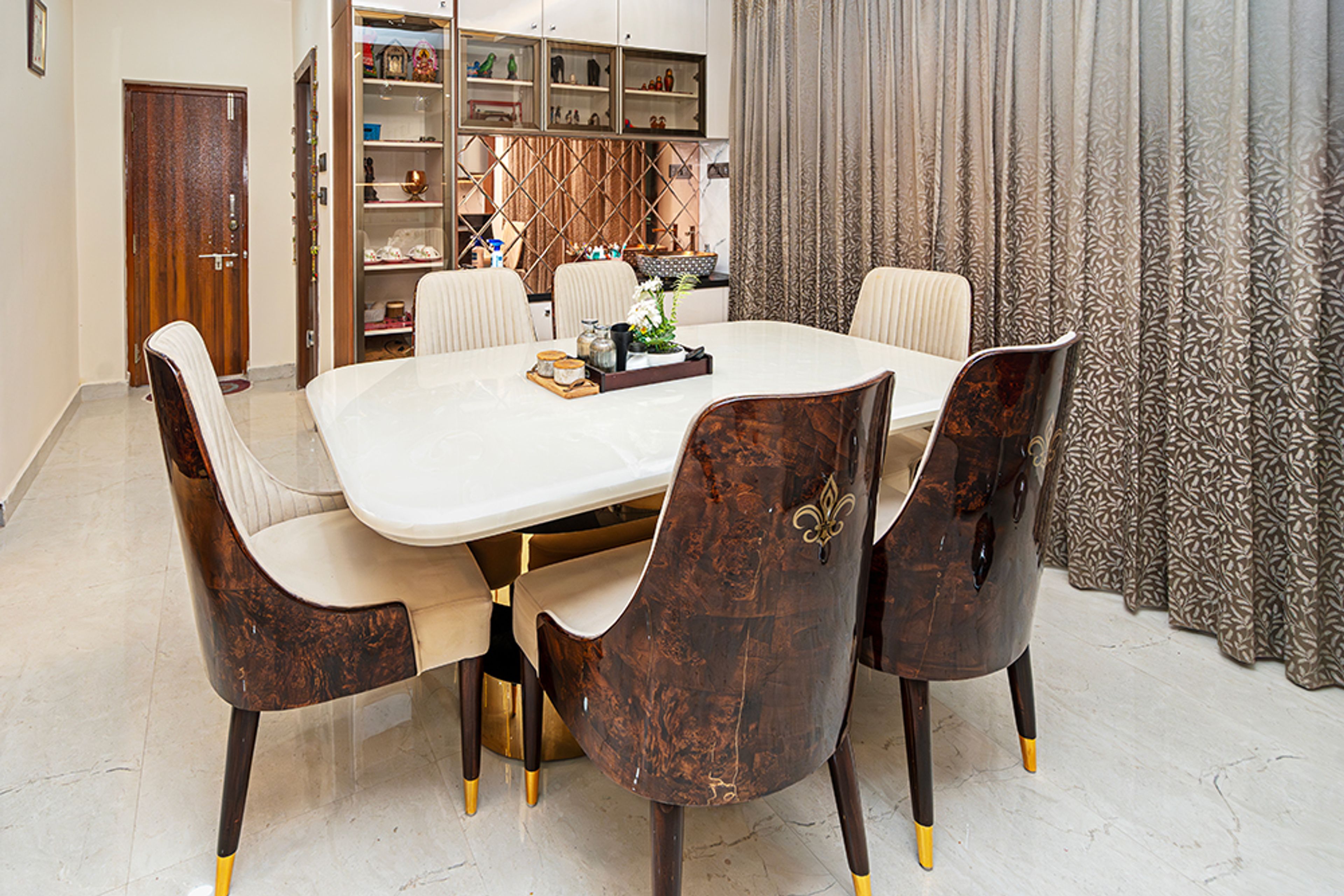 6-Seater Dining Room Design With Marble Table and Floorr-to-Celing Open Shelving