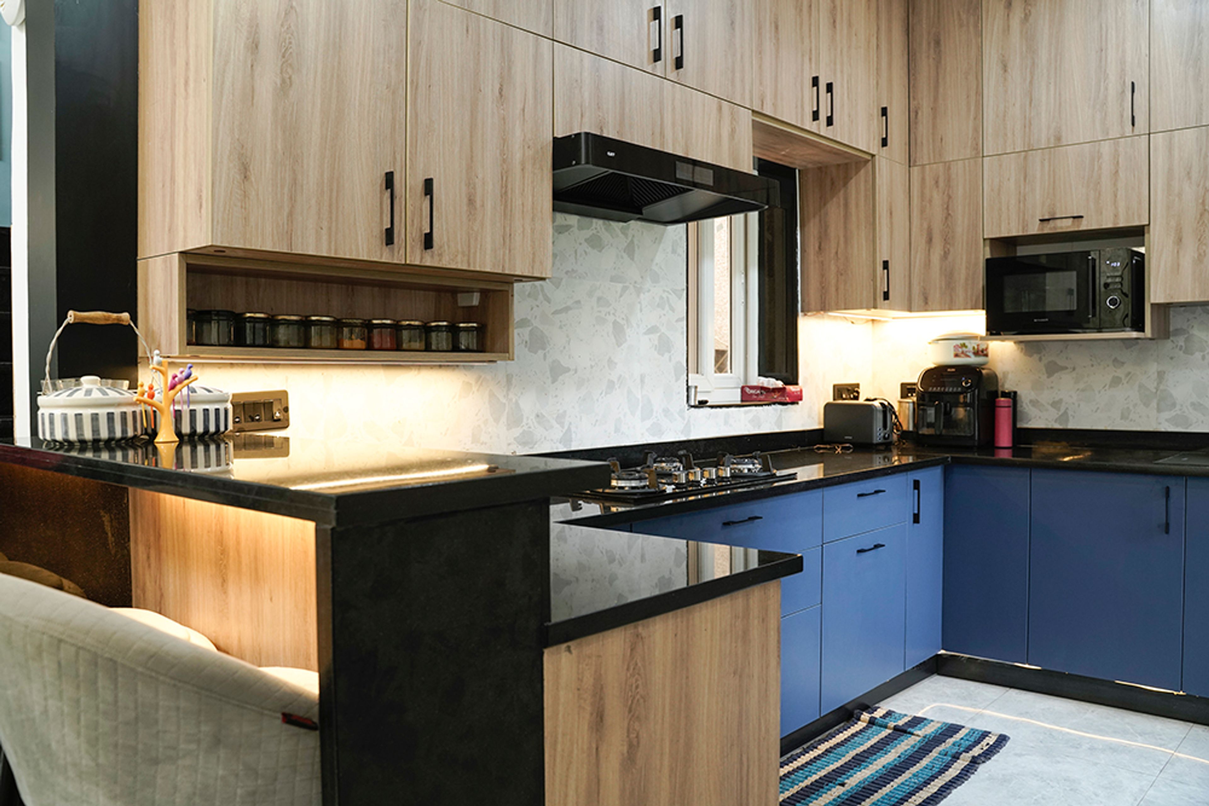 U Shaped Kitchen Design in Blue and Wood Finish With Black Granite Countertop