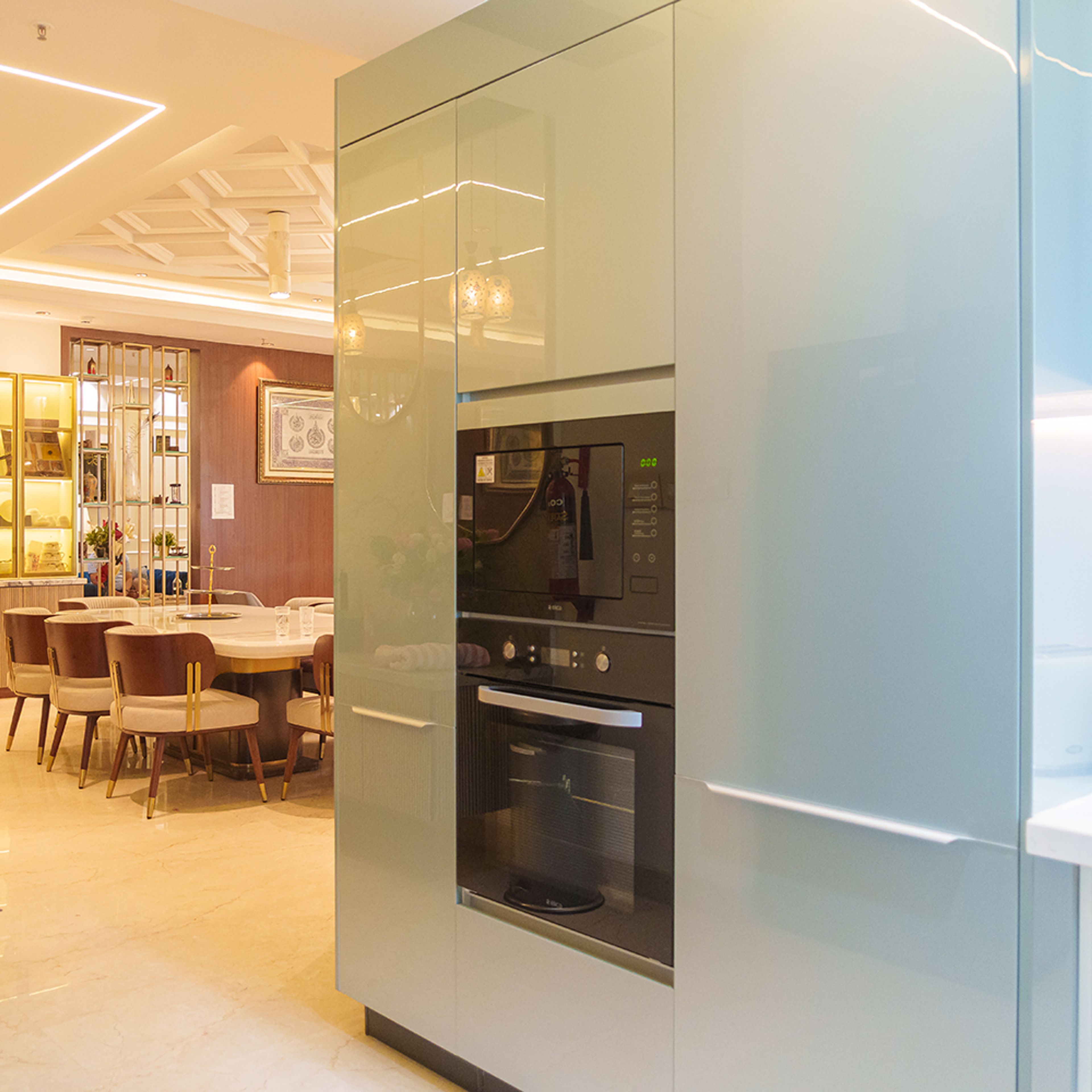 U-Shaped Kitchen Design with Glass Cabinets and Quartz Counter