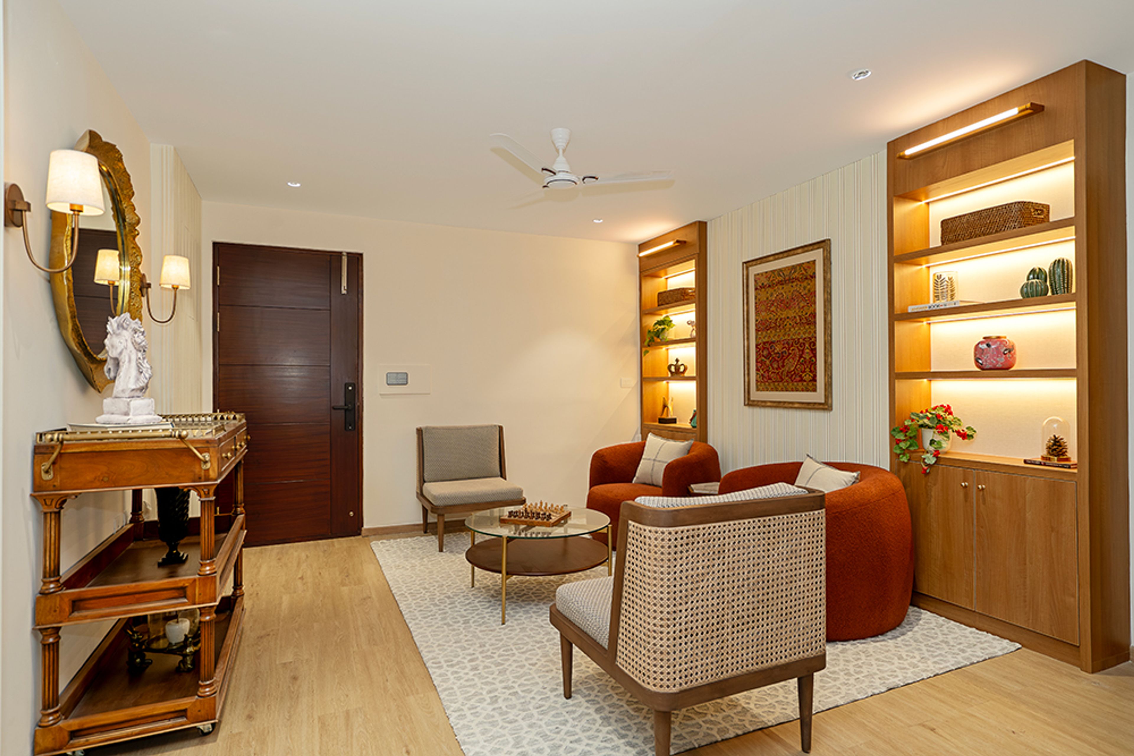 Contemporary Living Room Design with Built-in Shelves and Barrel Style Accent Chairs