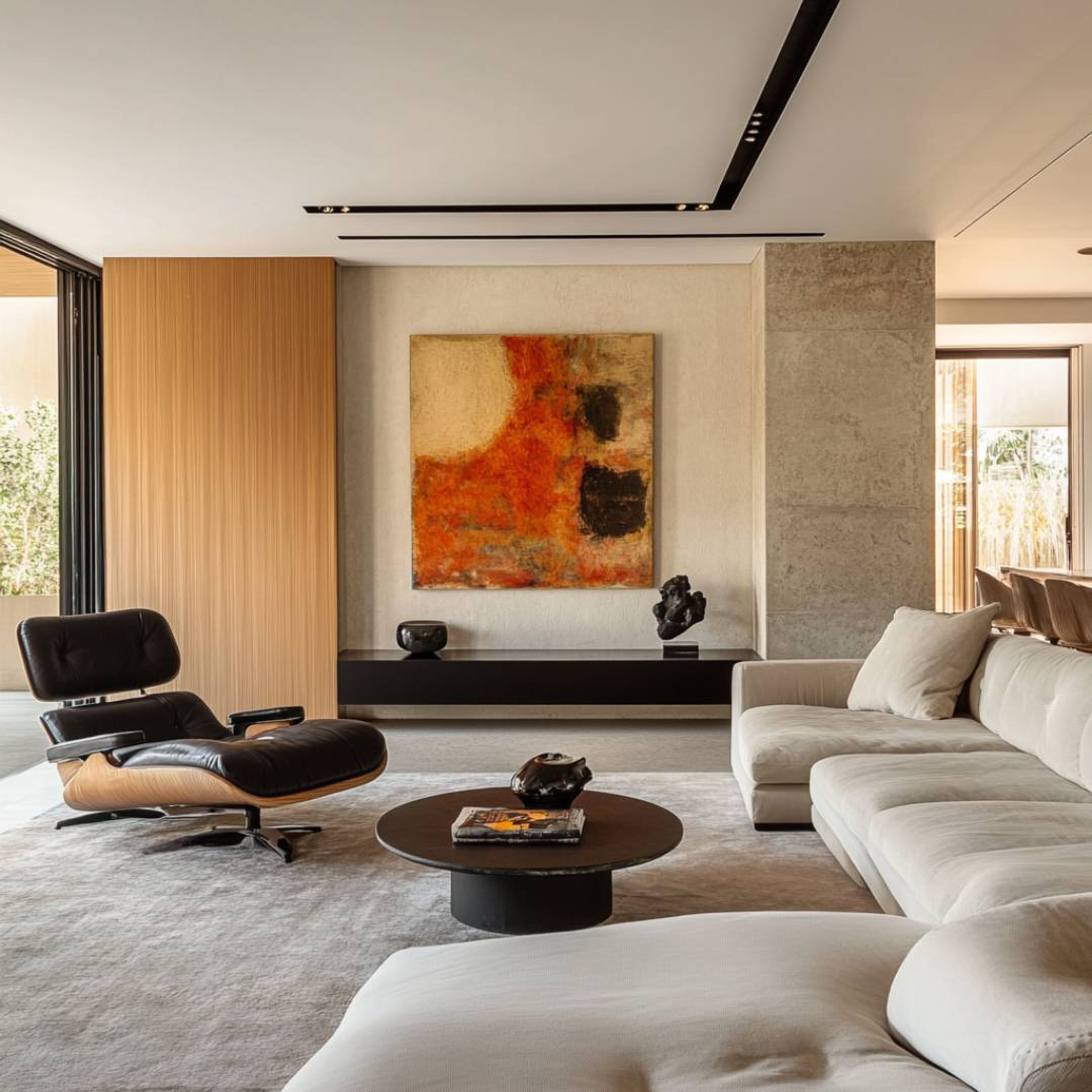 Living Room Design With L-Shaped Sofa and Bold Abstract Art