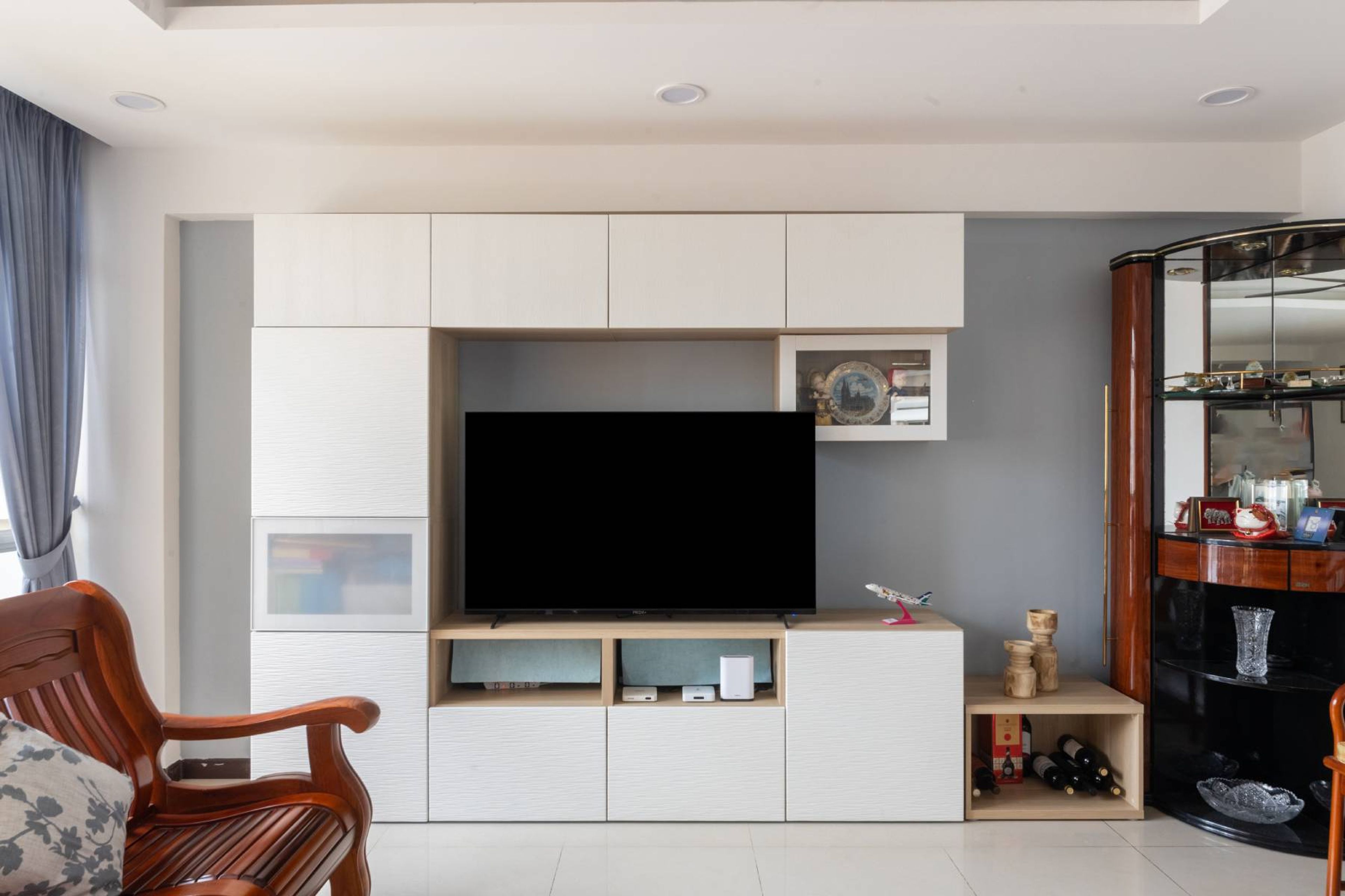 White TV Cabinet Design With Closed Storage And Glass Shutters - Livspace