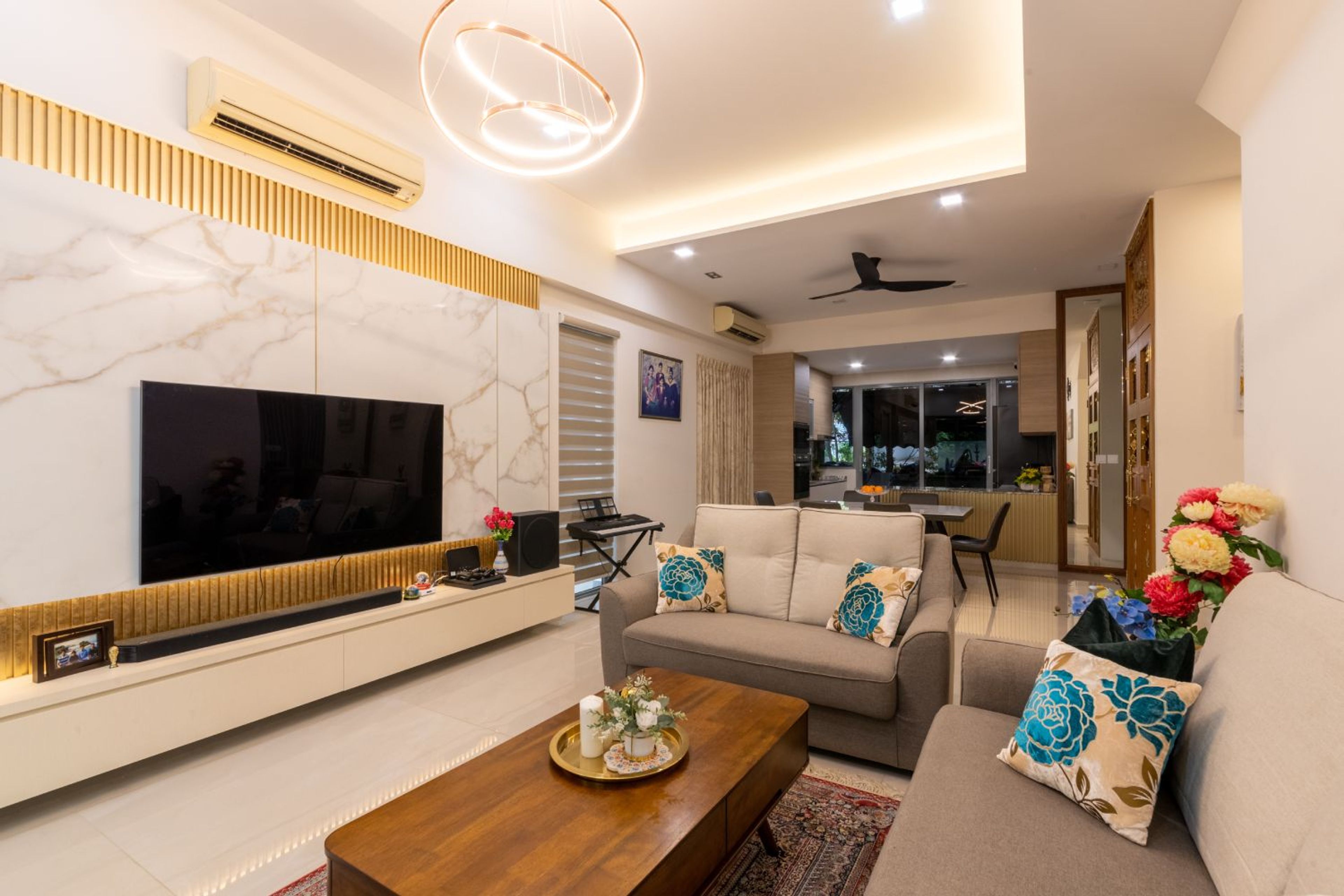 Living Room Wall Design With White-Grey Marble Wall Panel And Gold Fluted Skirting - Livspace