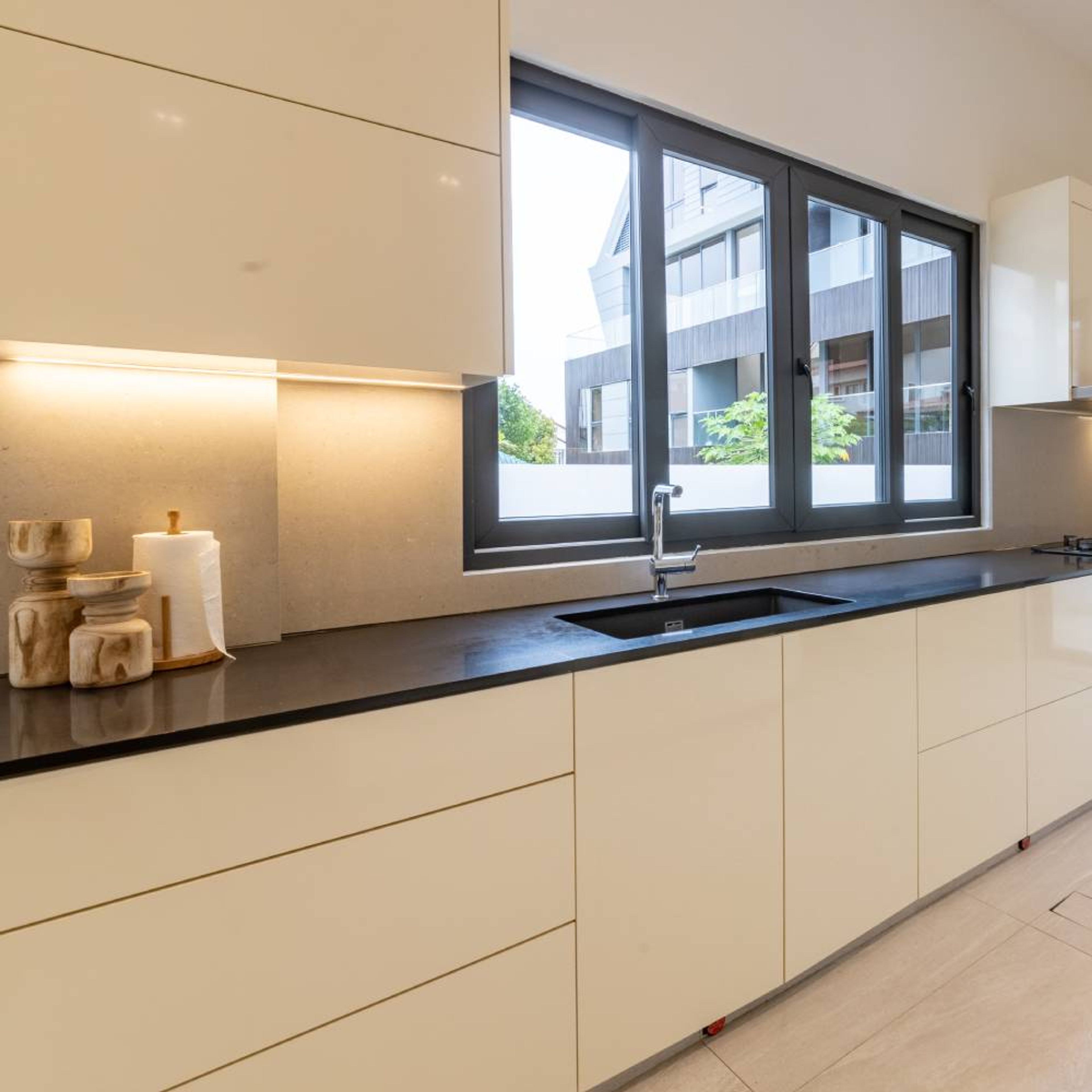 Rectangular Black Quartz Kitchen Sink With Black Kitchen Countertop - Livspace