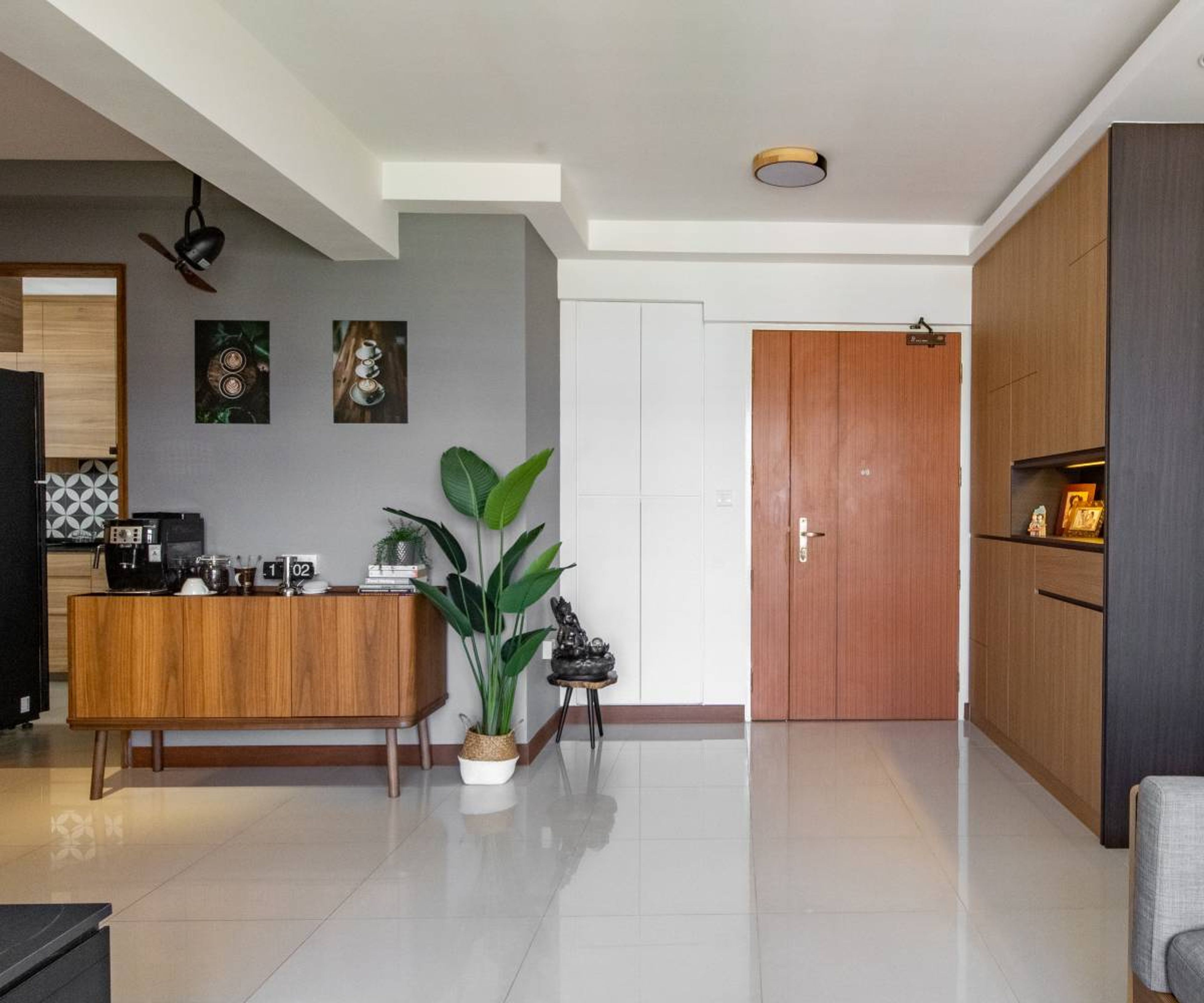 White And Brown Foyer Design With Floor-To-Ceiling Storage Unit- Livspace