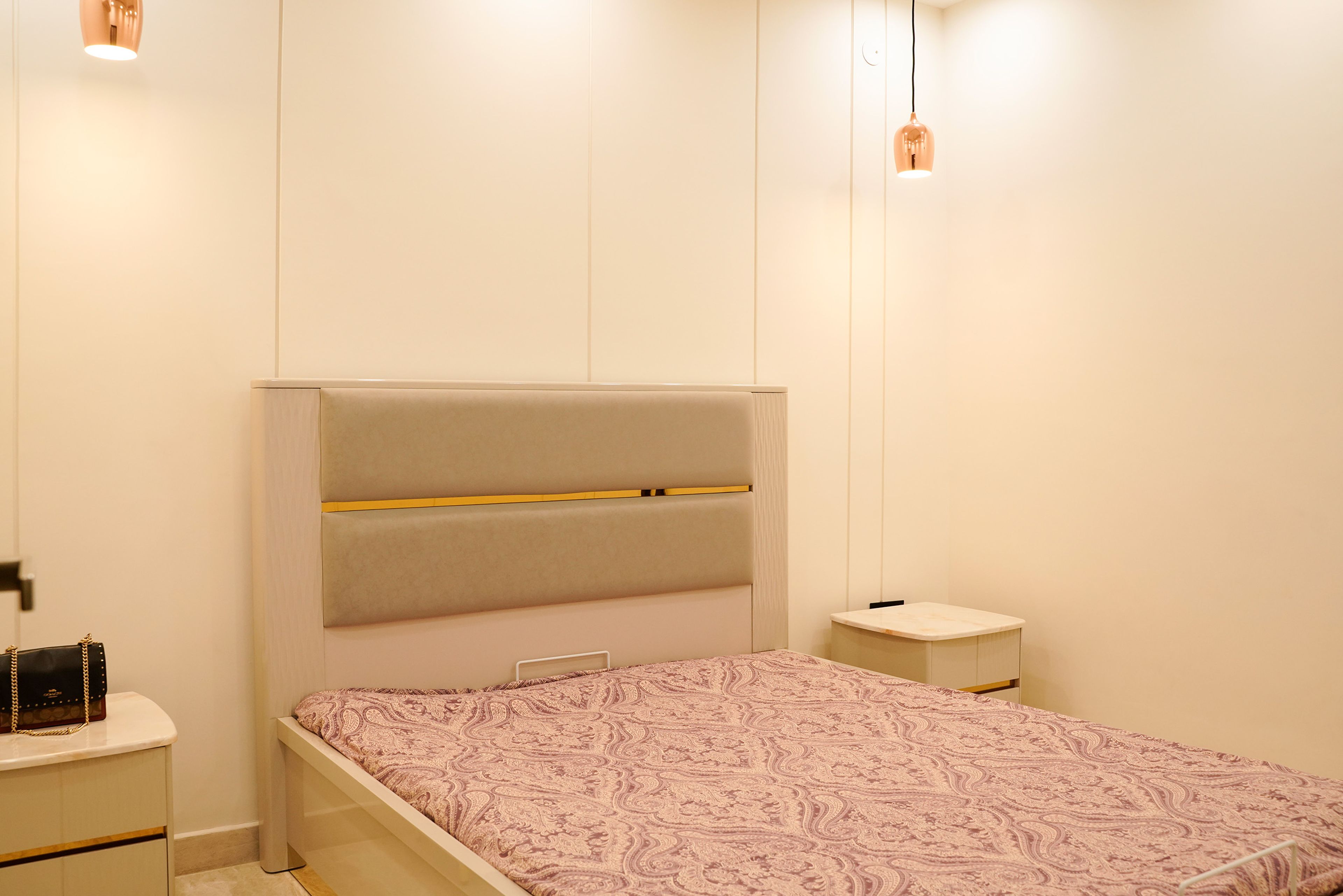 Modern Guest Bedroom Design with Cream Bed and Arched White Wardrobe