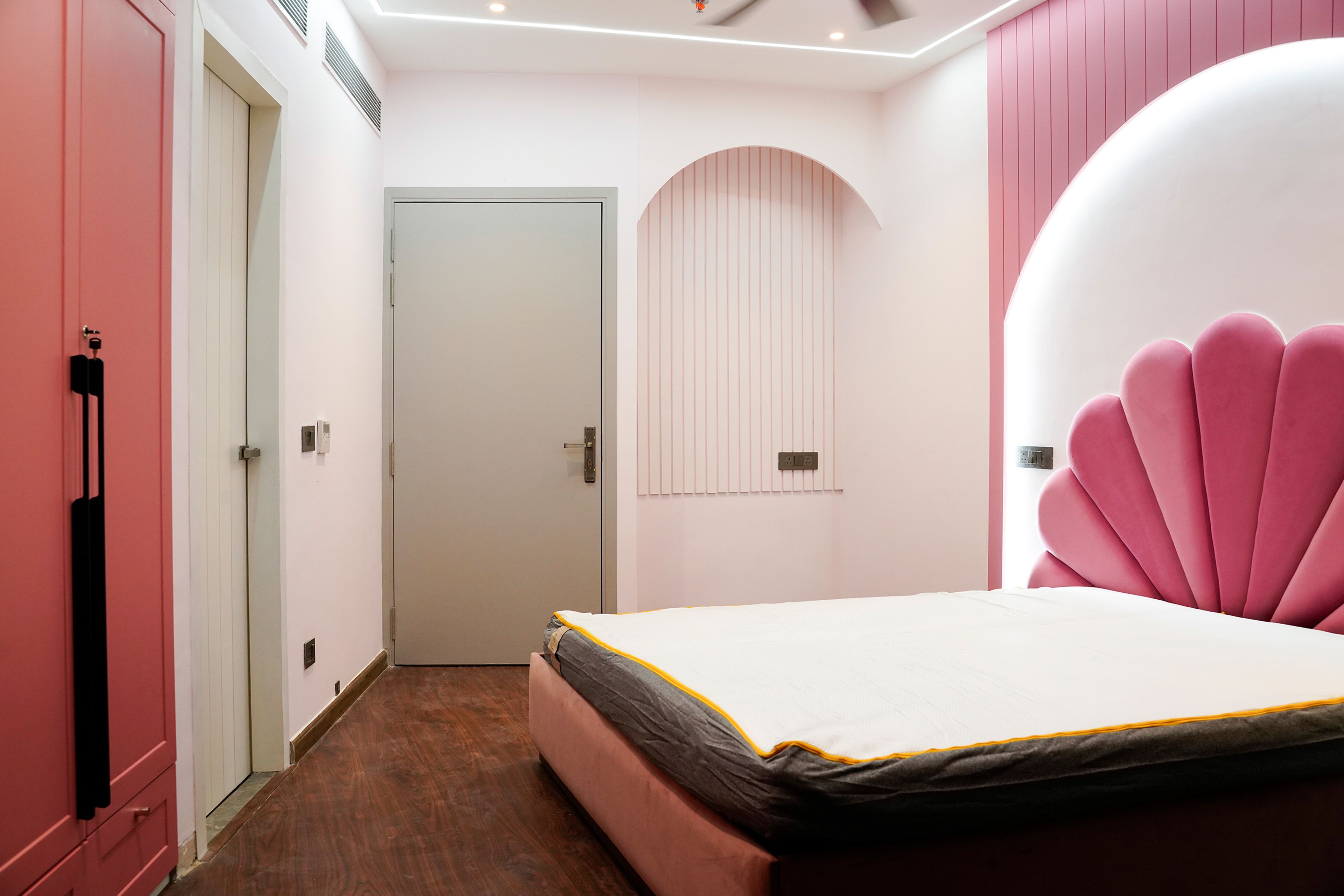 Kids Bedroom Design With Pink Velvet Shell Headboard and Wardrobe