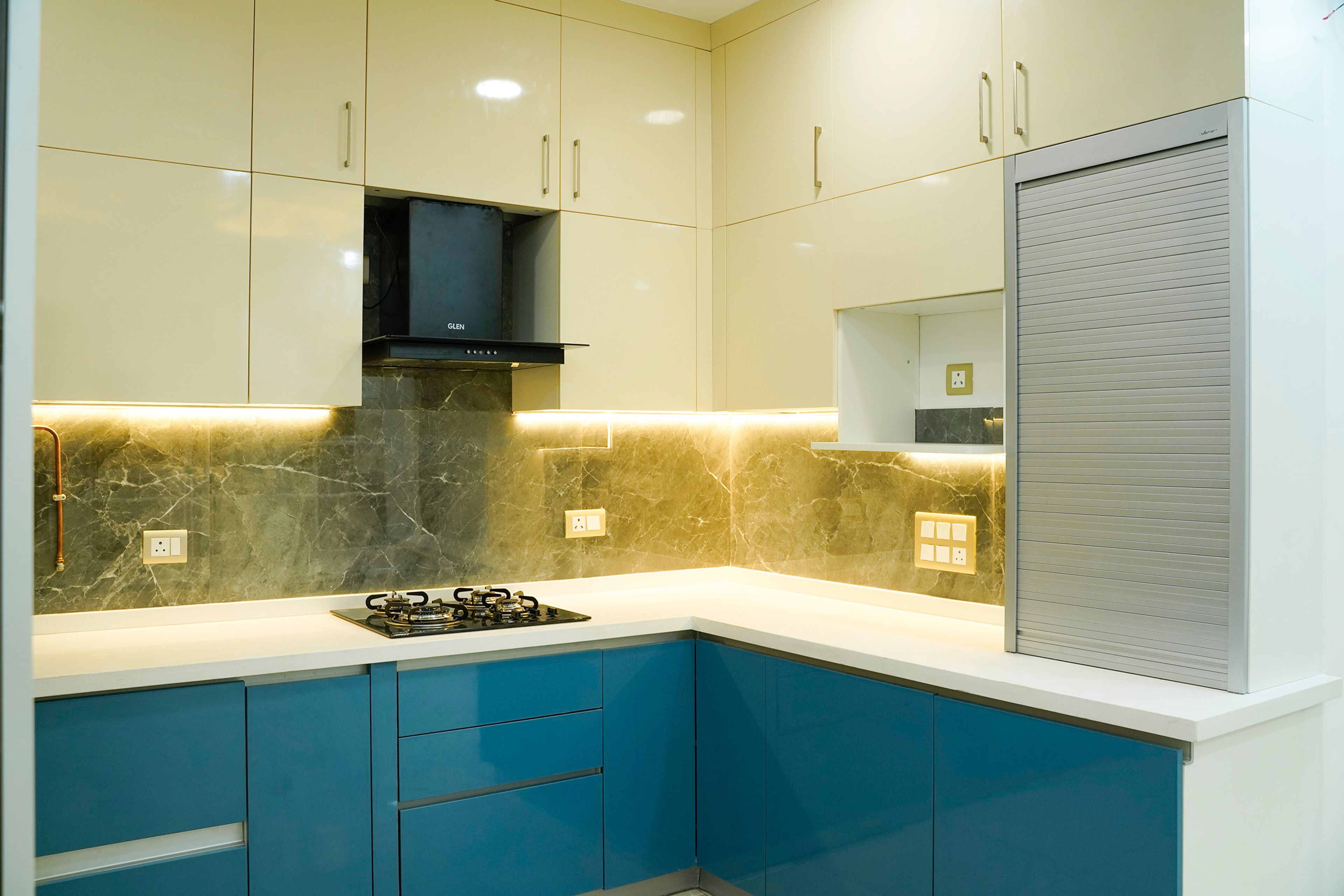 Contemporary L-Shaped Kitchen Design with Glossy Champagne Cabinets