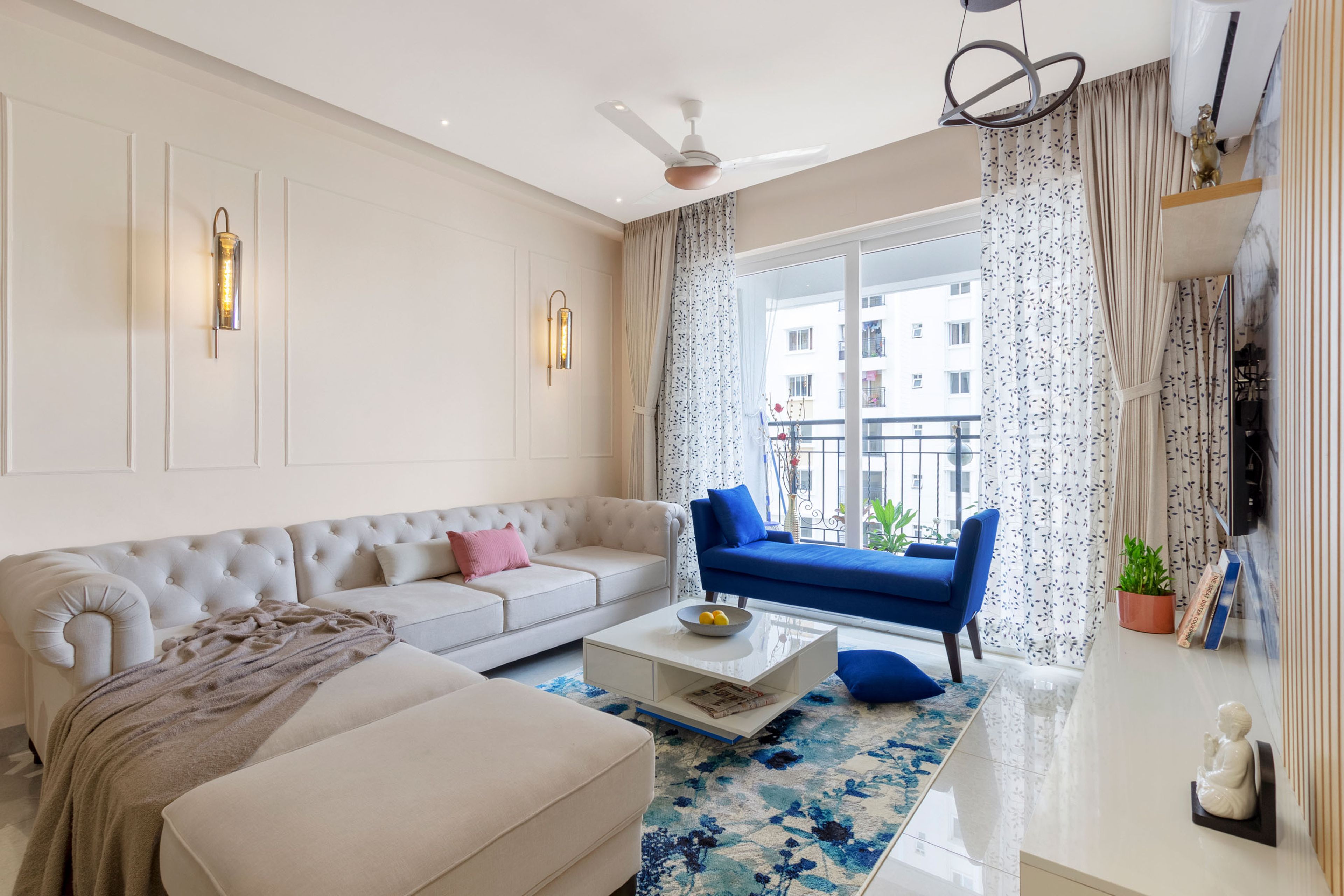 Contemporary Living Room Design With Beige Sectional and Blue Accent Bench