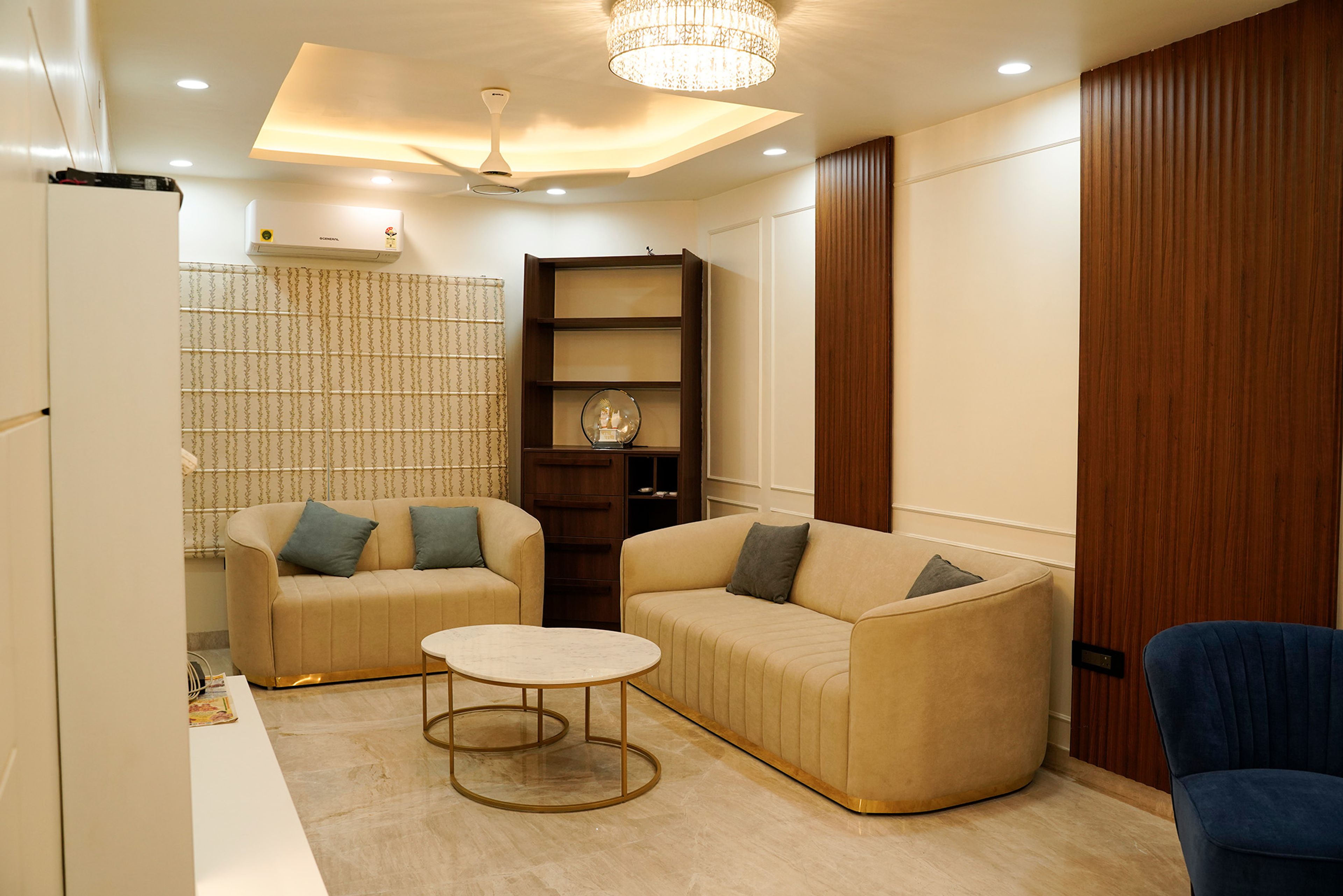 Contemporary Living Room Design With Beige Sofas and Blue Chairs