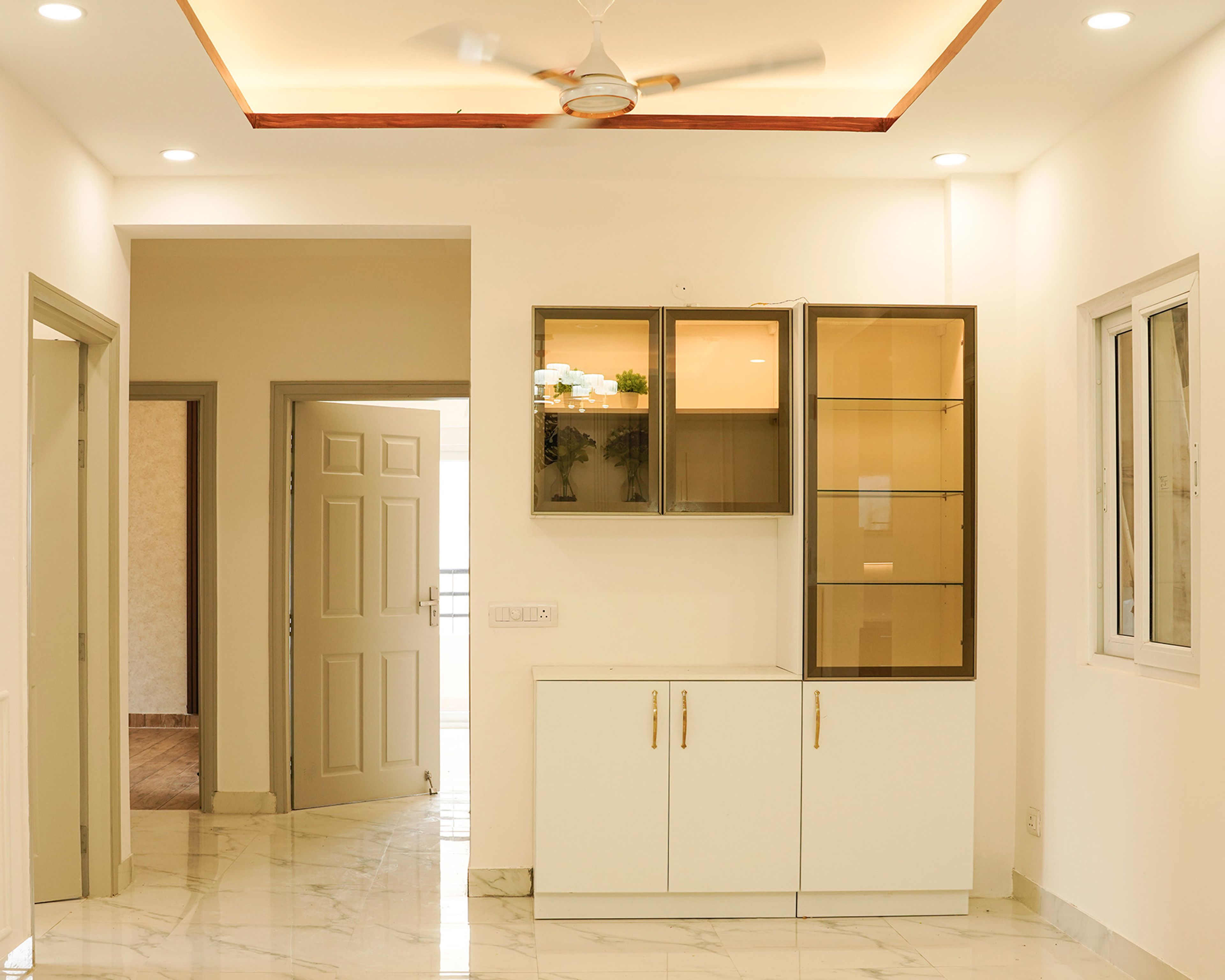 Modern Crockery Unit Design with Glass Display and Concealed Storage