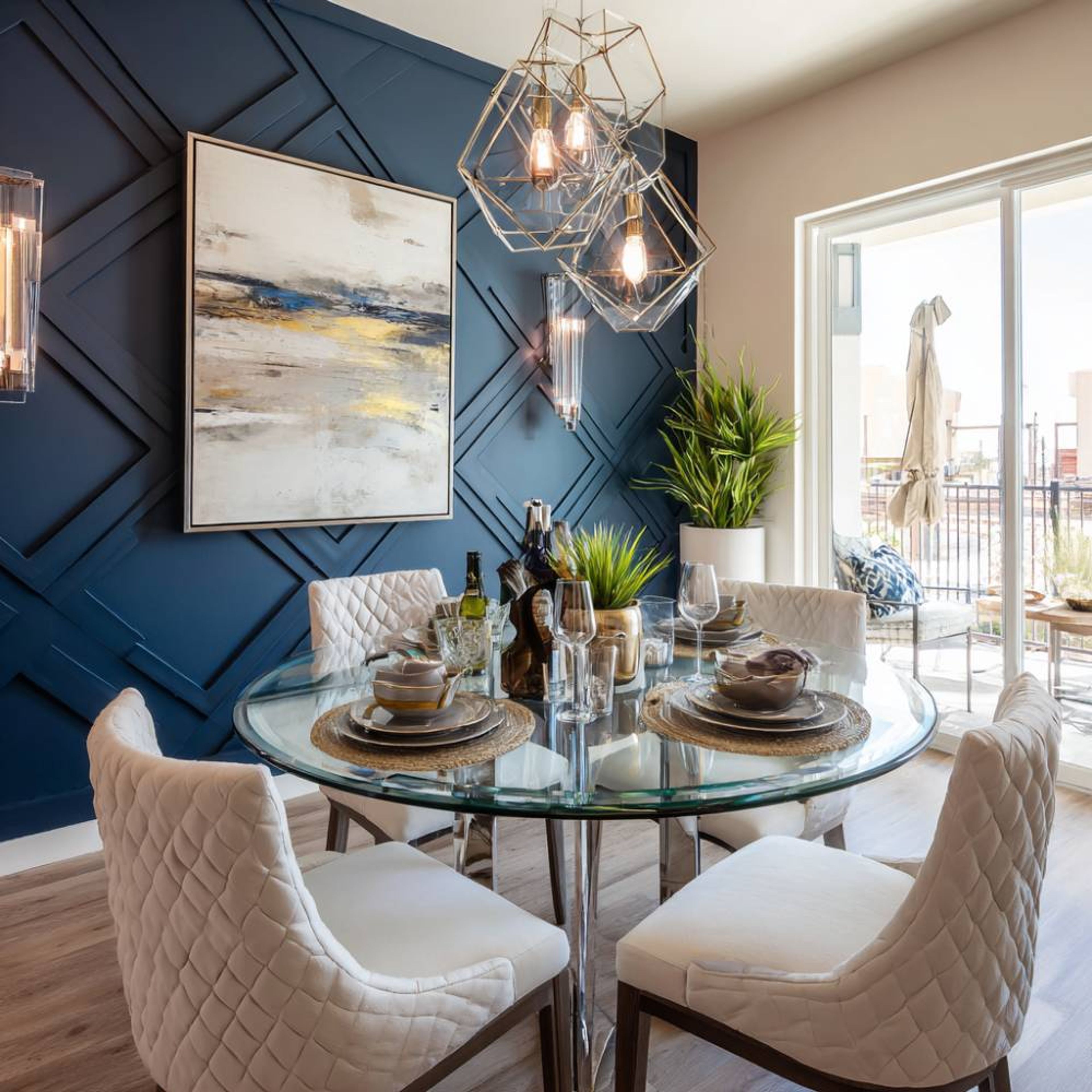 Dining Room Design with Round Glass Table and Quilted Seating