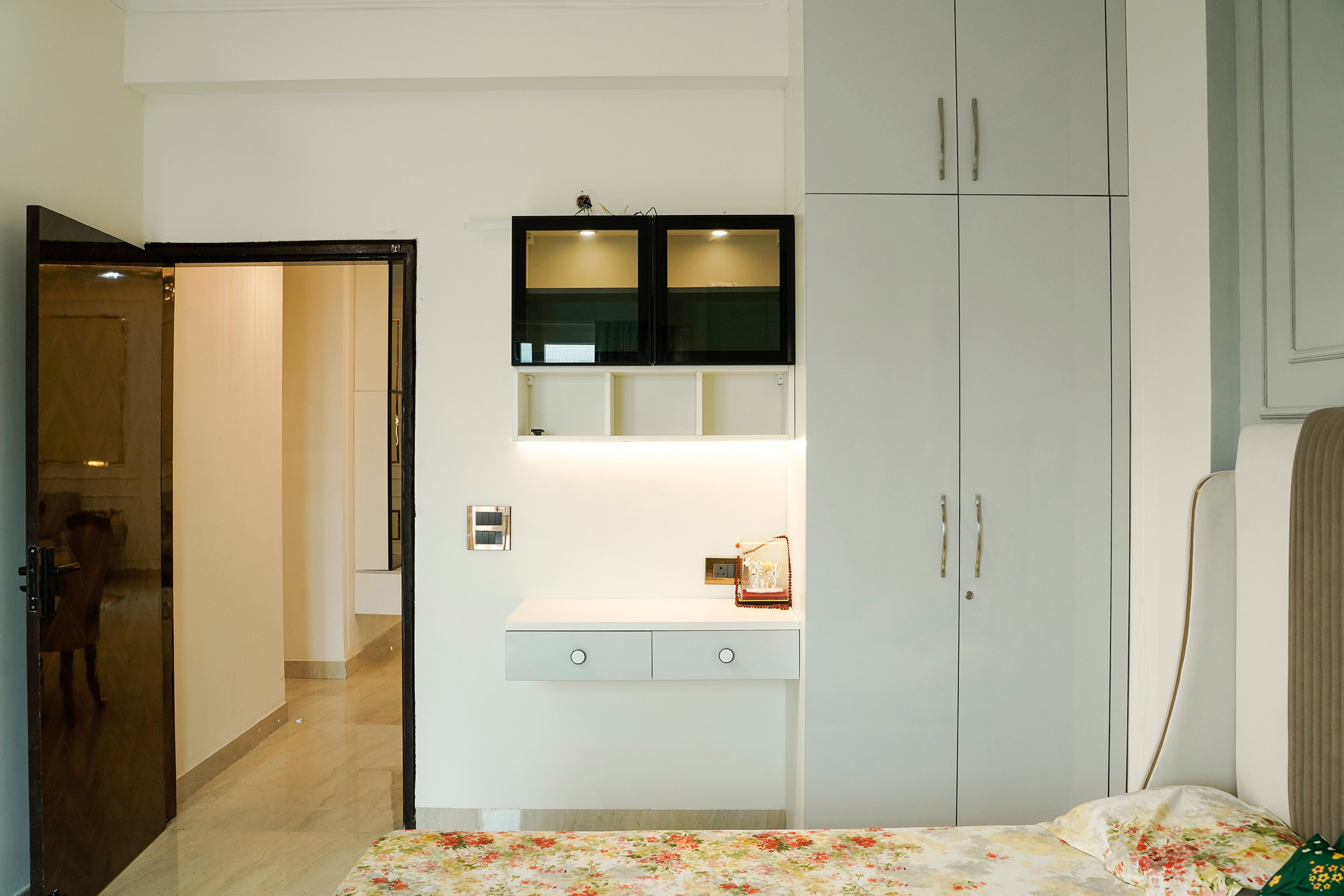 Guest Bedroom Design Featuring Glossy Grey Wardrobe and Floatig Study Desk
