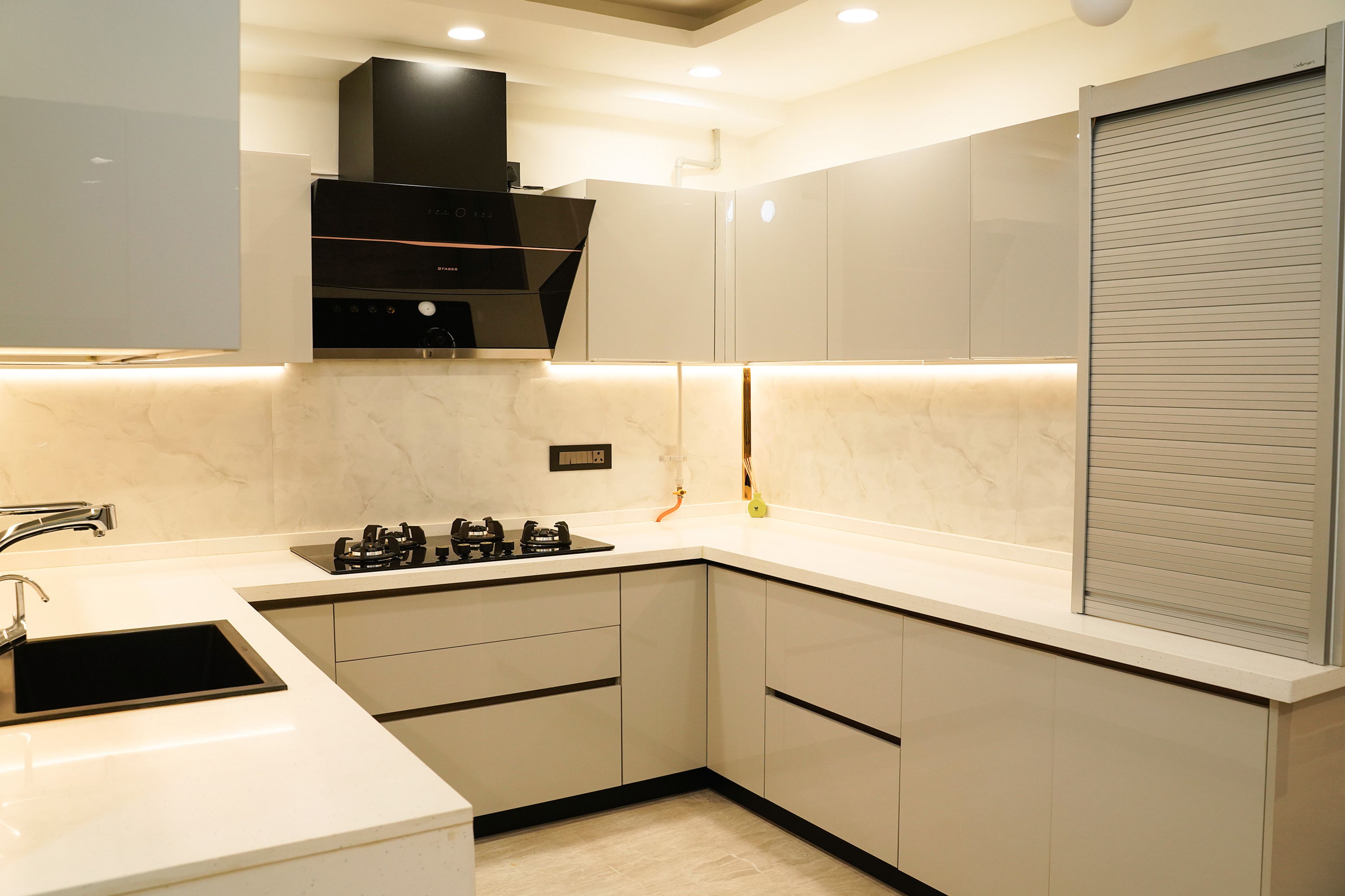 U-Shaped Modern Kitchen Design with Black Chimney and Under-Cabinet Lighting
