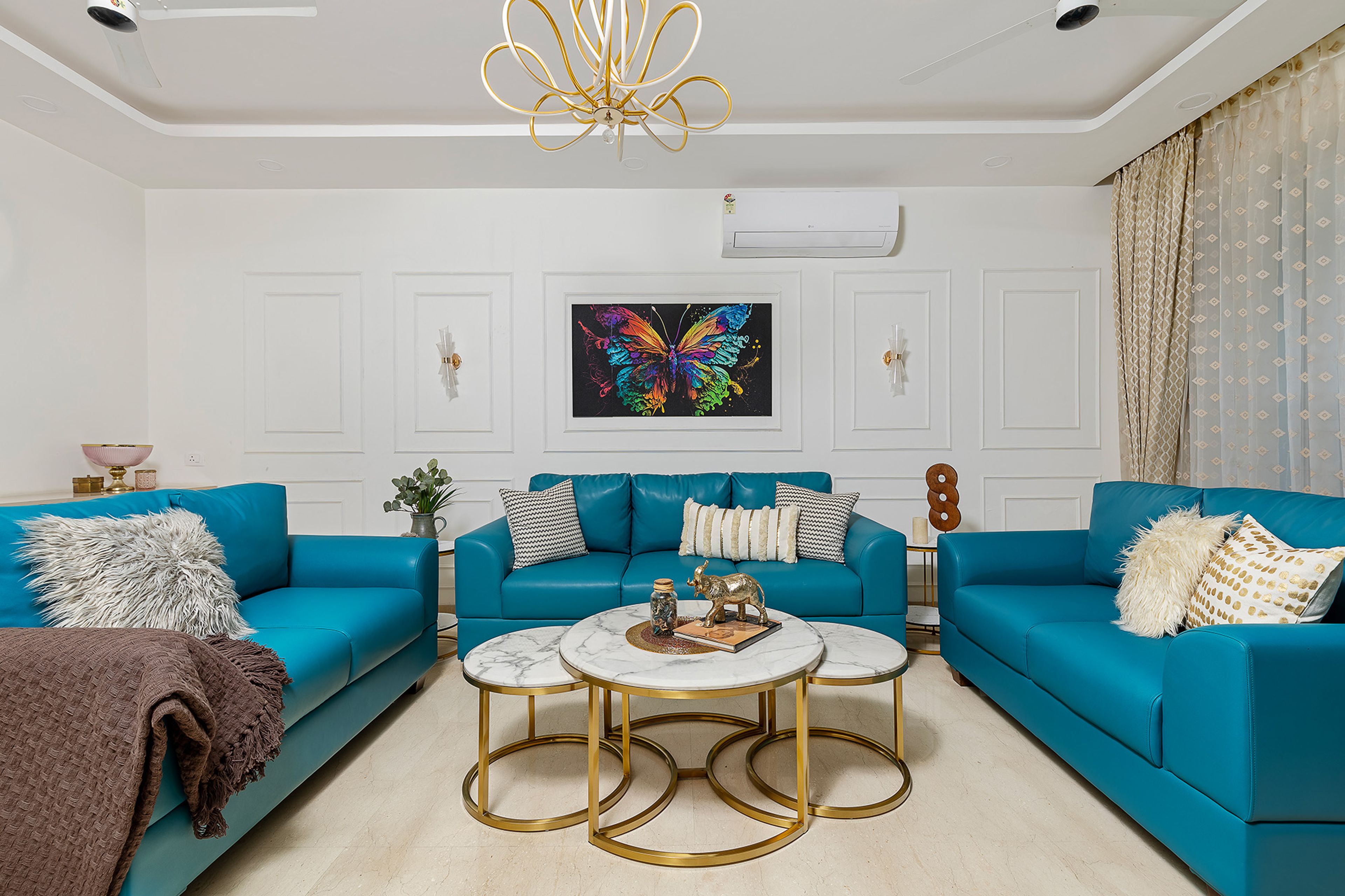 Modern Living Room Design with Teal Leather Sofas and Nested Marble Top Table