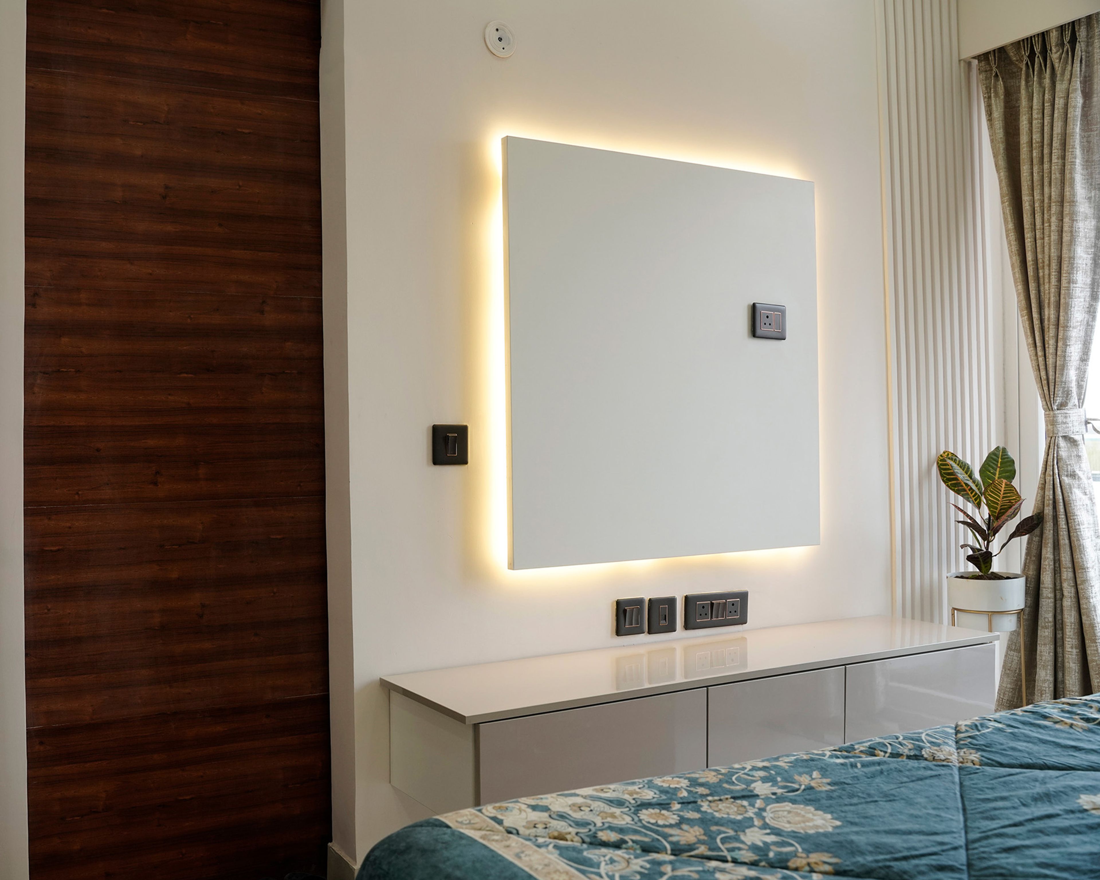 Guest Bedroom Design with Glossy Wardrobes and Upholstered Headboard