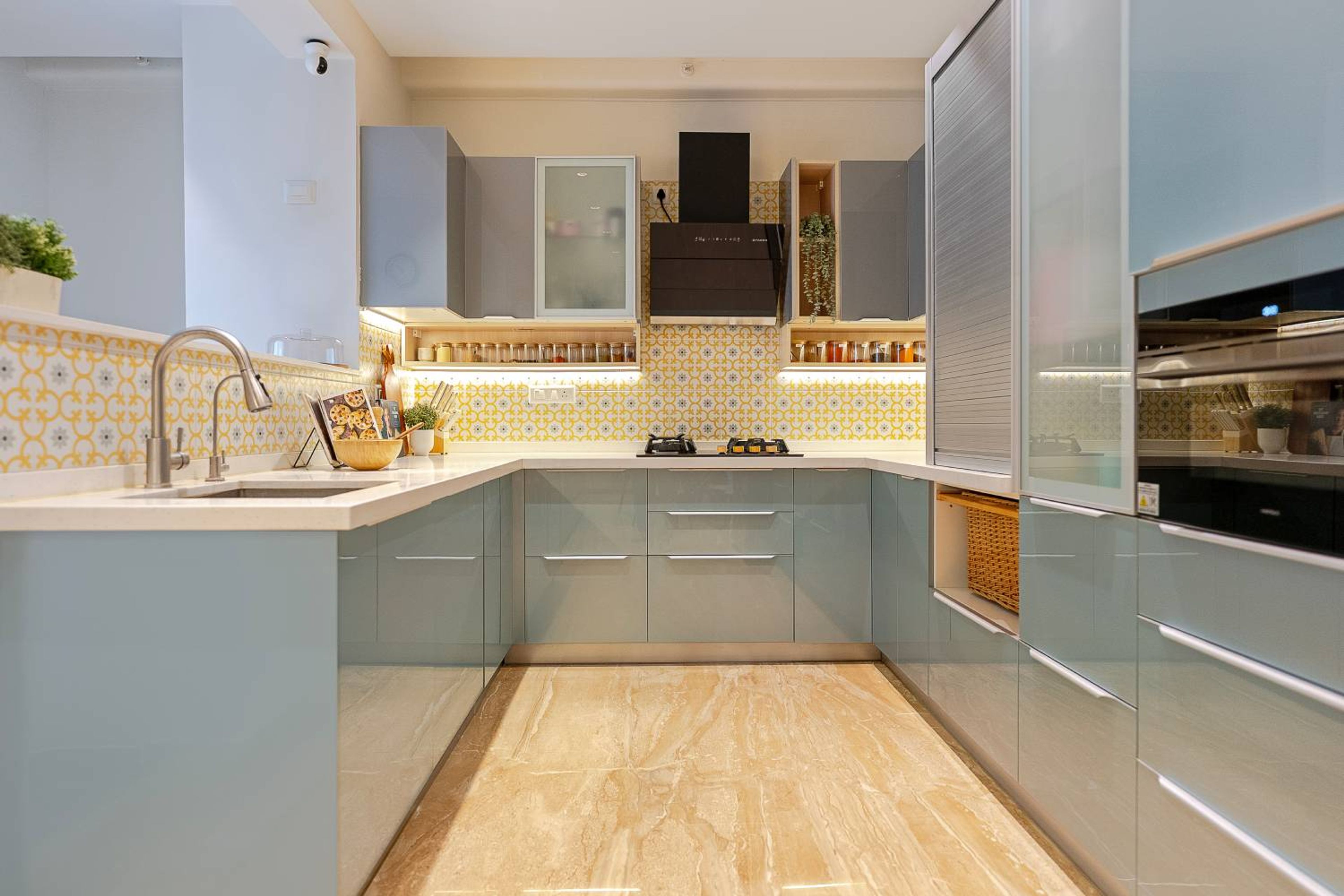 Modern U-Shaped Kitchen Design with Glossy Green and Grey Cabinets and Quartz Countertoo