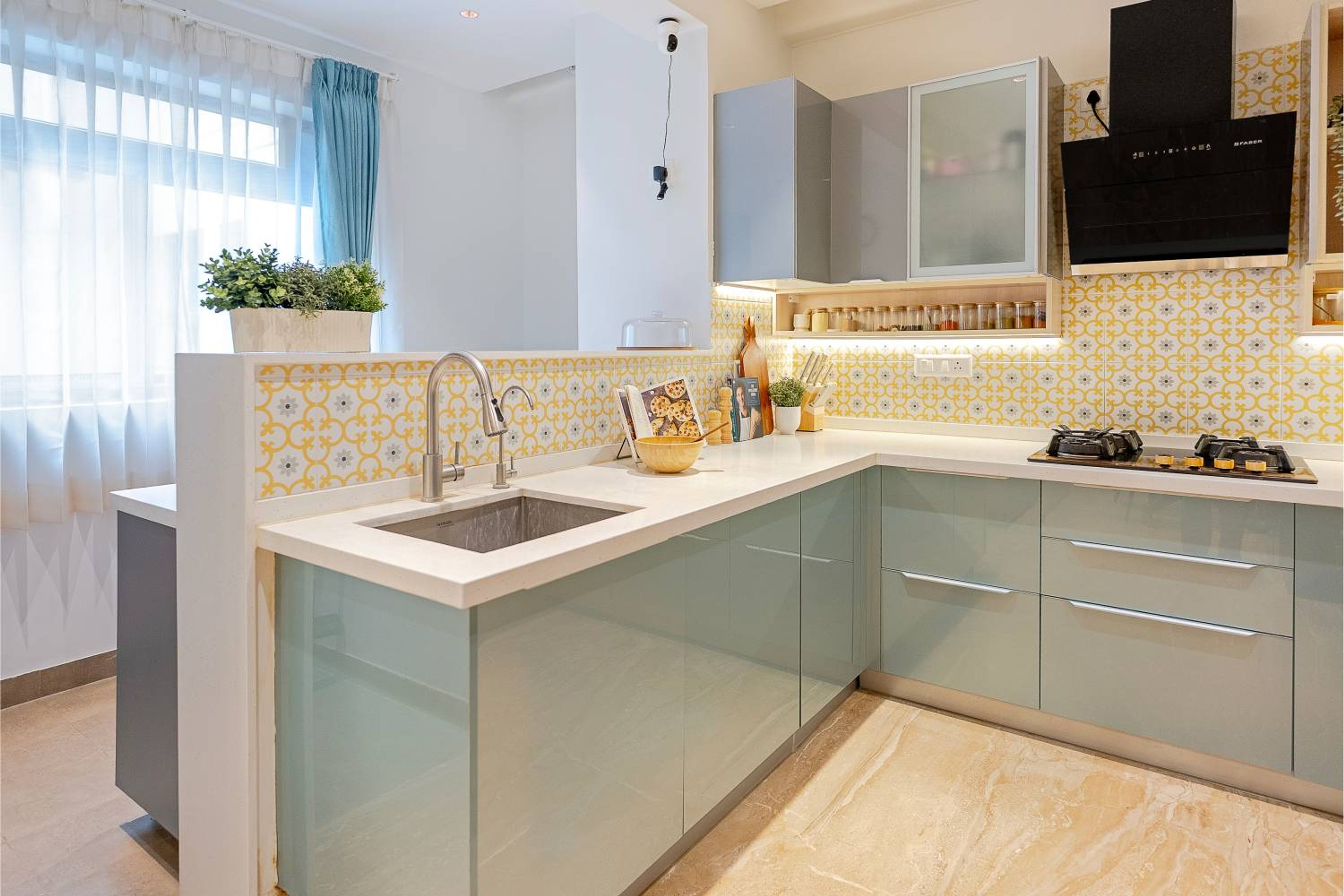 U-Shaped Kitchen Design with Glossy Green and Grey Cabinets and Quartz Countertoo