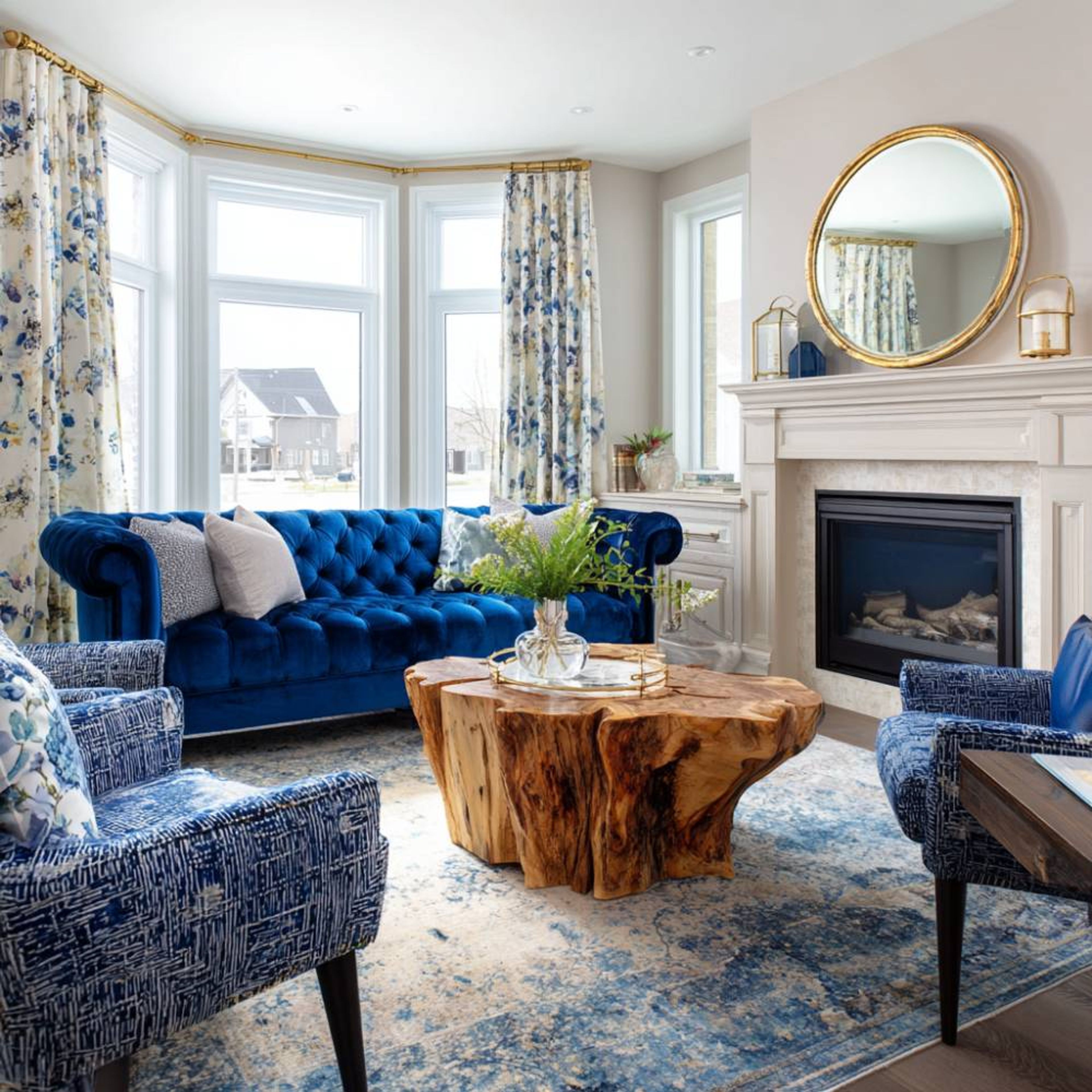 Living Room Design with Blue Chesterfield Sofa, Wooden Coffee Table and Armchairs