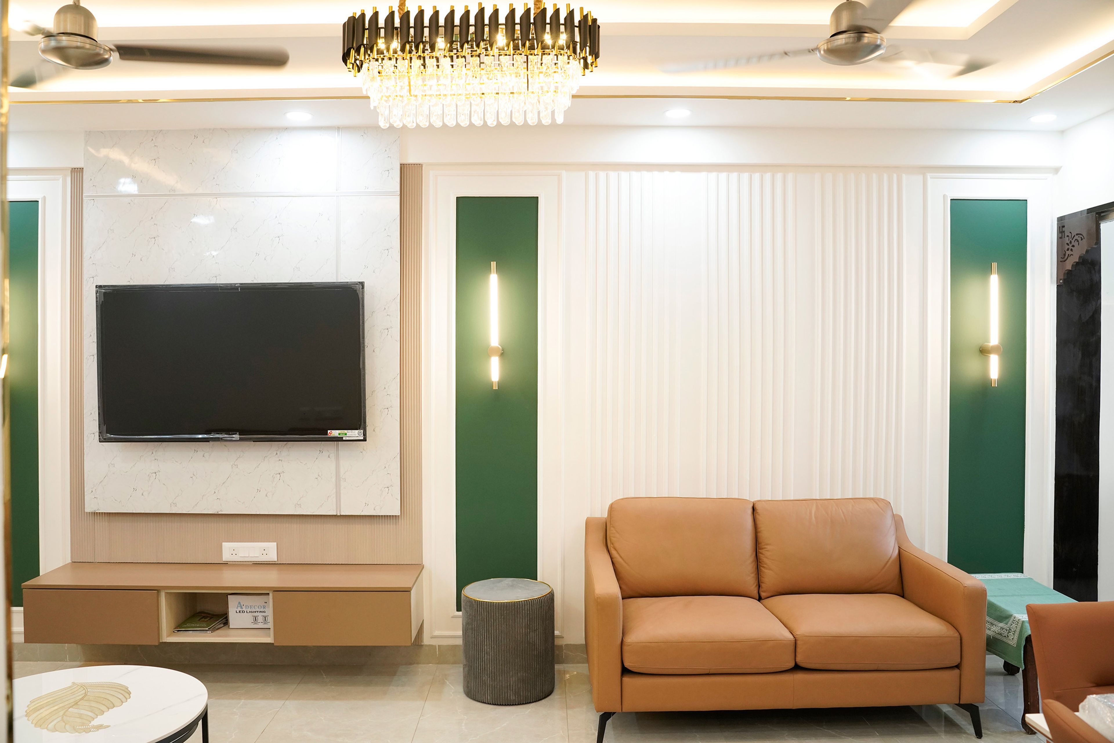 Living Room Design with Marble TV Wall and Leather 2-Seater Sofa and Lounge Chair