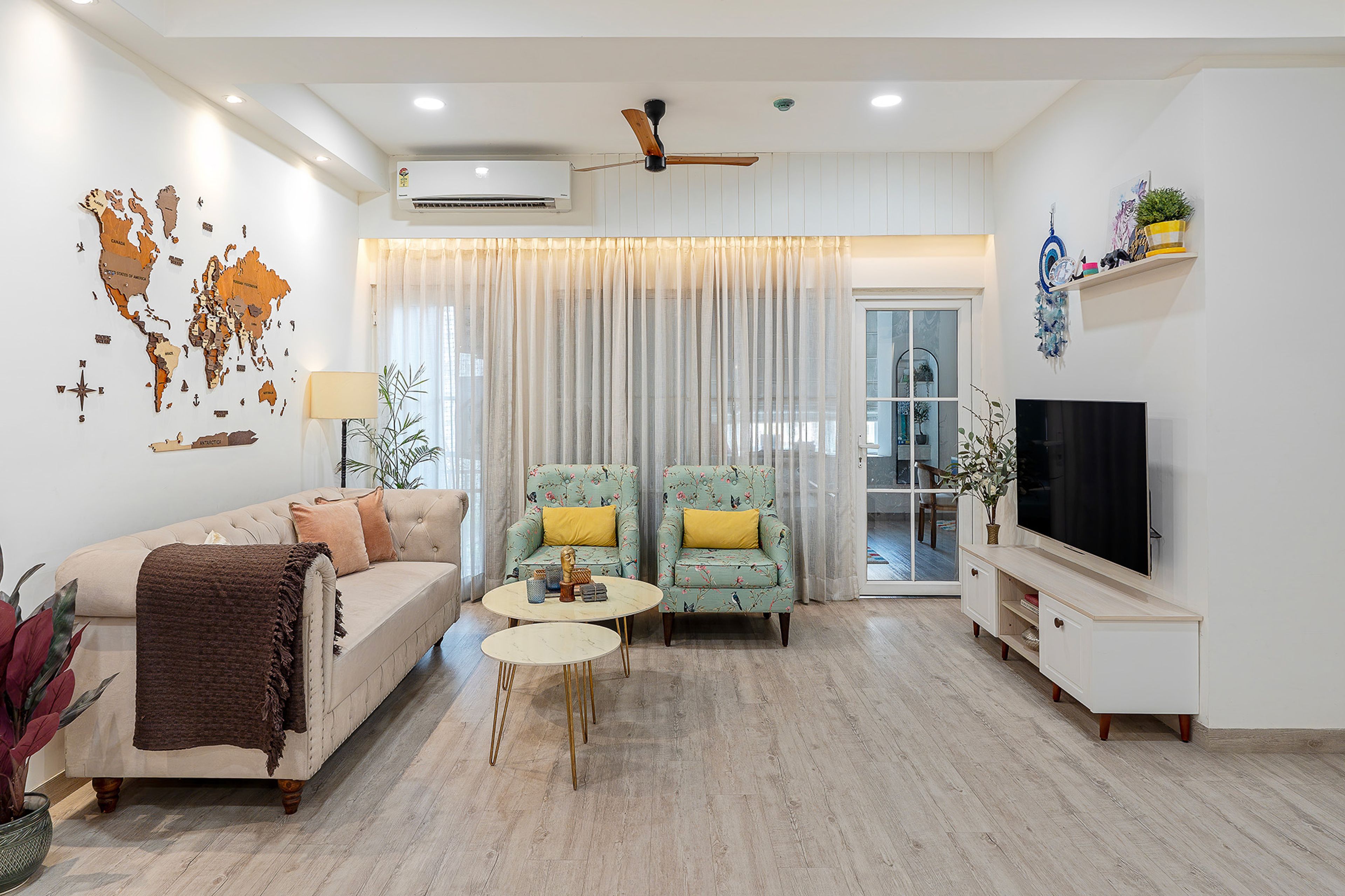 Contemporary Living Room Design with Mint Floral Armchairs and Tufted Sofa