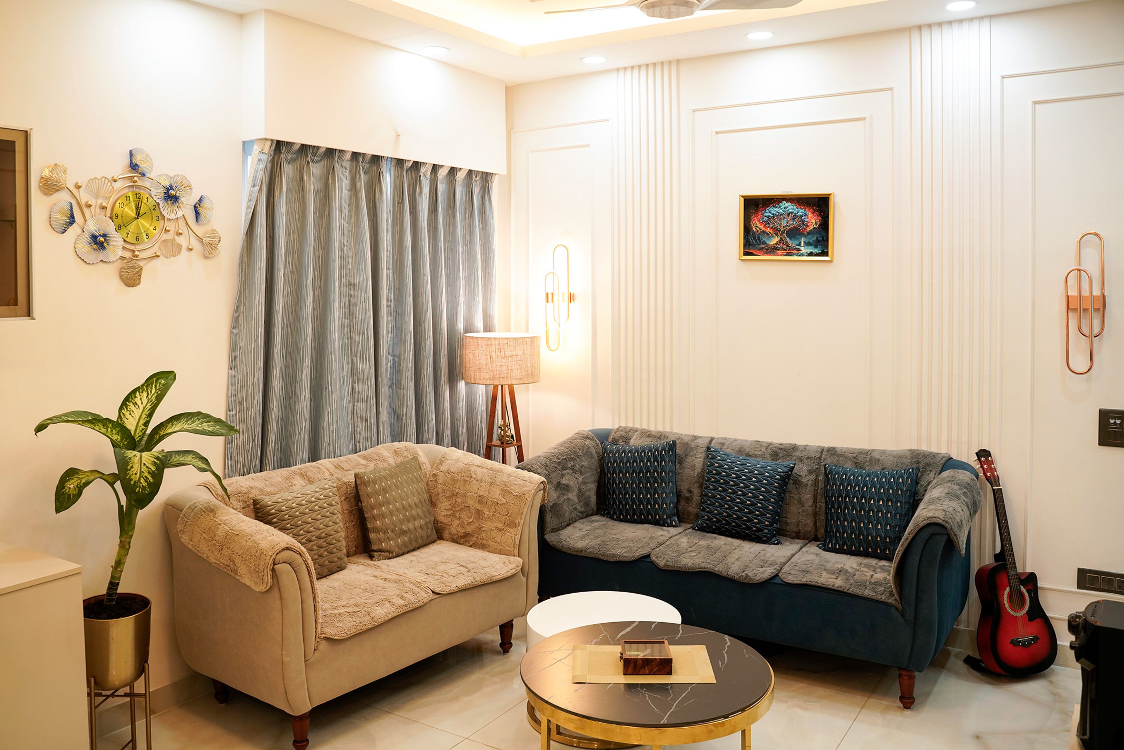 Transitional Living Room Design with Dual Colour Sofas and Gold Table