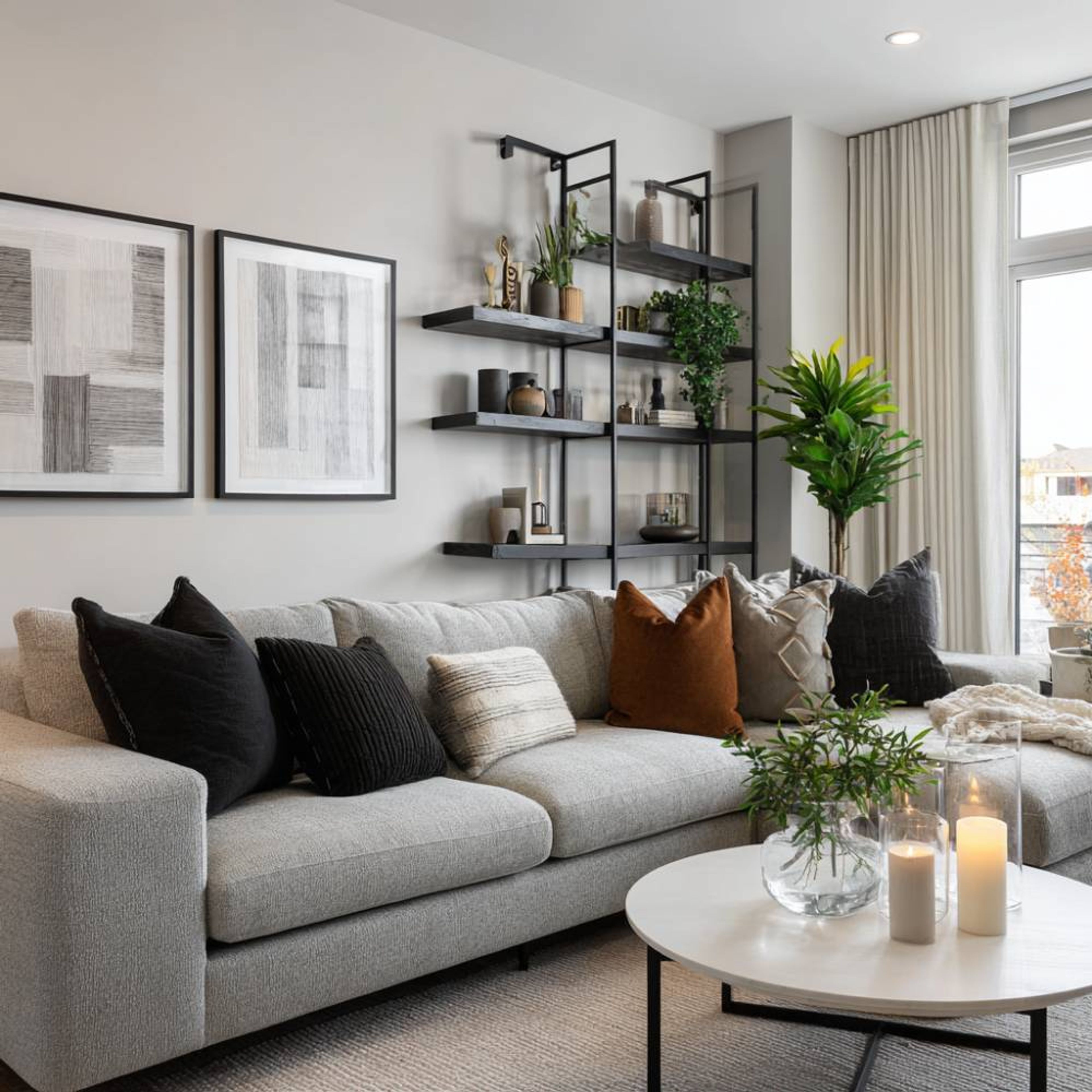Modern Living Room Design with Grey Sectional Sofa and Tall Shelving