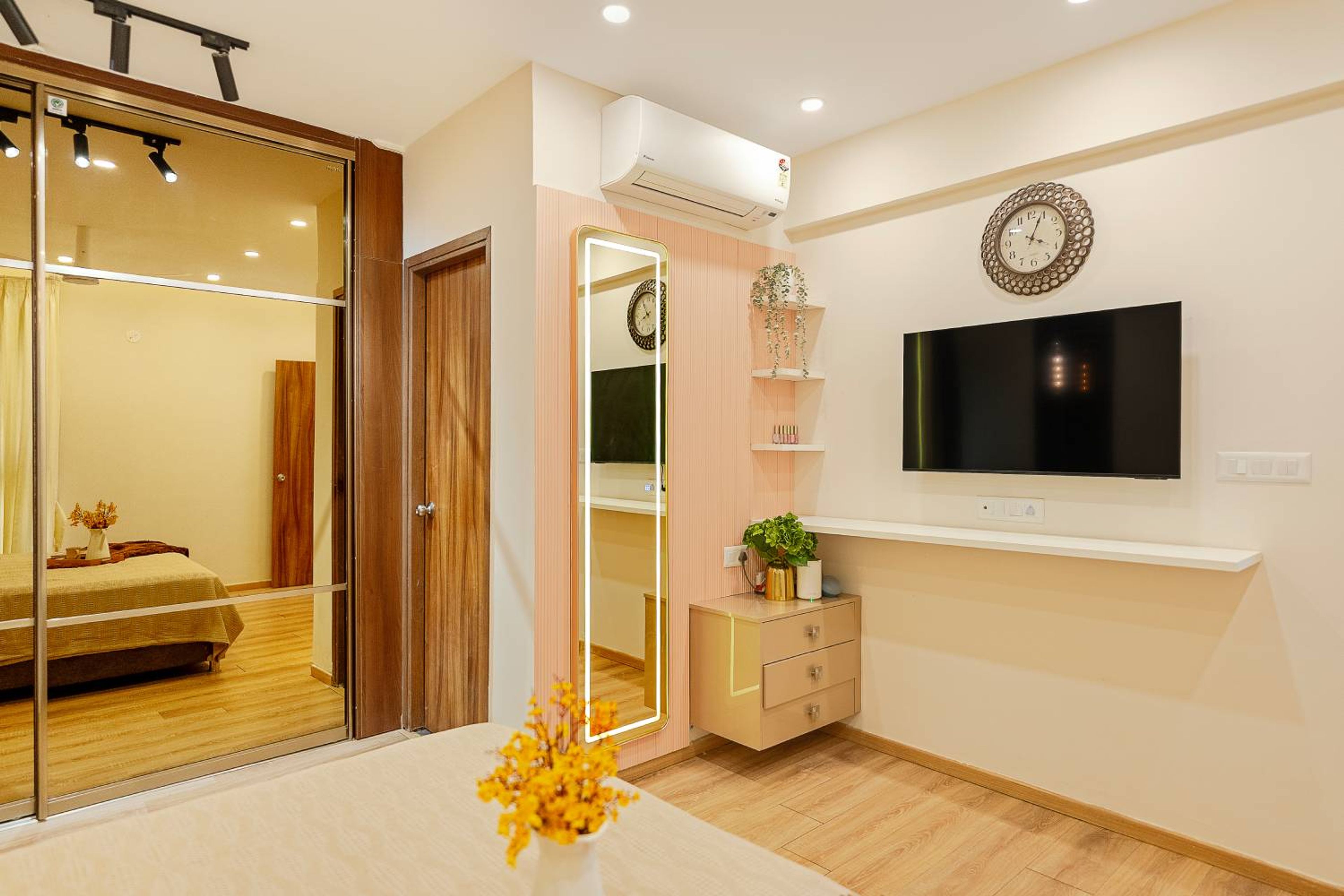 Master Bedroom Design With Mirrored Wardrobe and Padded Headboard